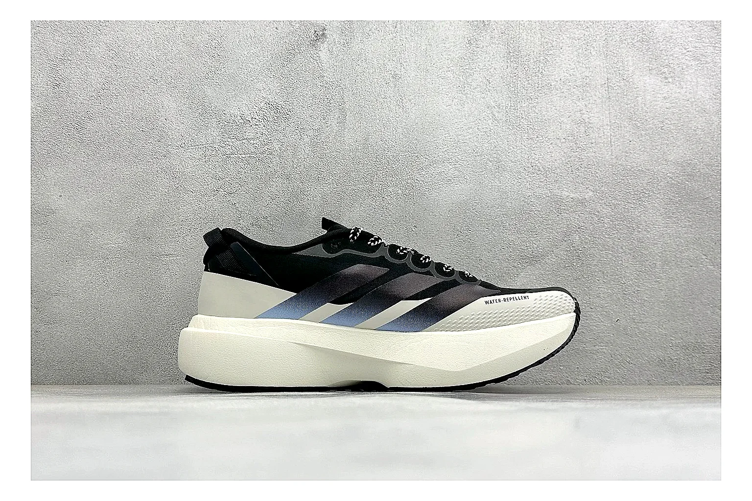 Adidas Adizero Evo Black QC reference photo showing black racing upper, sculpted white sole, Adidas striping, and lightweight performance silhouette thumbnail 5