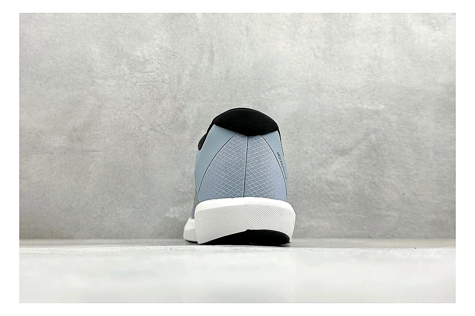 Adidas Adizero Grey Blue QC reference photo showing grey lightweight runner upper, blue Adidas striping, slim racing shape, and low performance sole