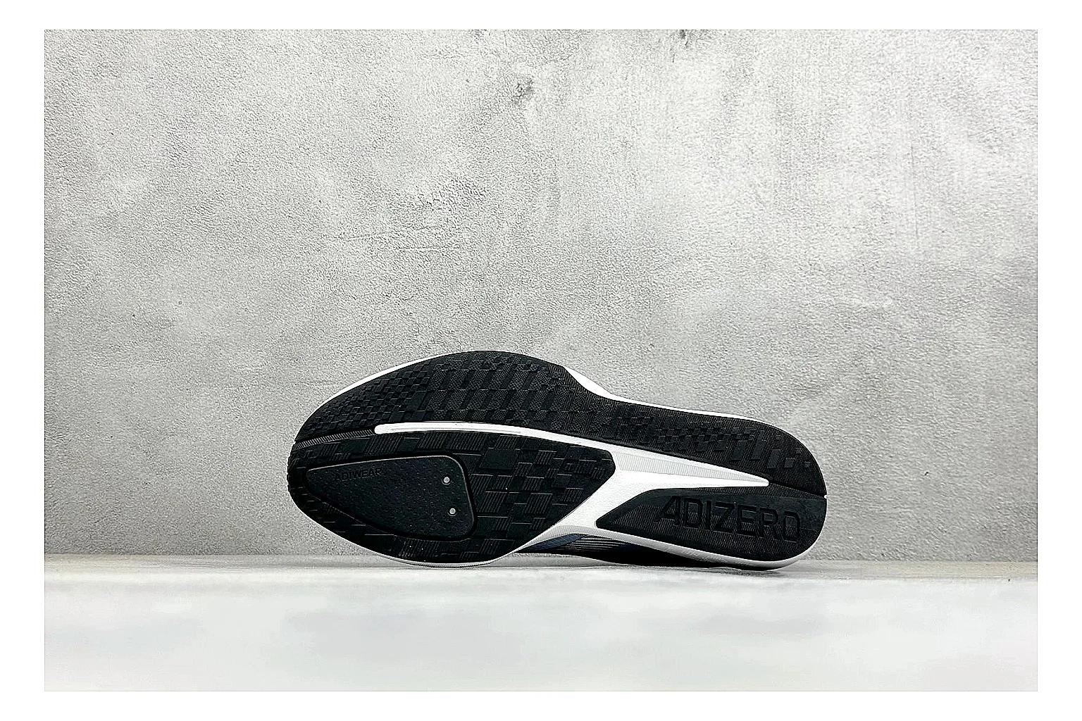 Adidas Adizero Grey Blue QC reference photo showing grey lightweight runner upper, blue Adidas striping, slim racing shape, and low performance sole thumbnail 3