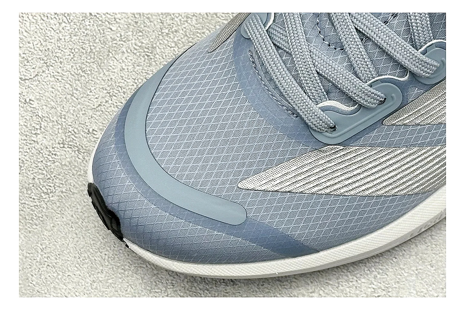 Adidas Adizero Grey Blue QC reference photo showing grey lightweight runner upper, blue Adidas striping, slim racing shape, and low performance sole thumbnail 4