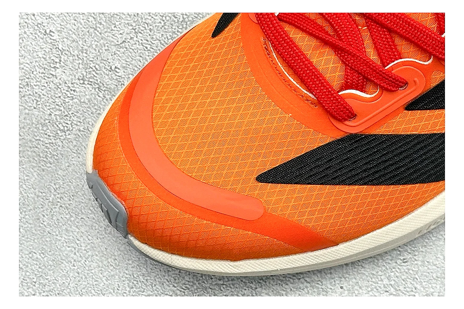 Adidas Adizero Orange Black QC reference photo showing orange runner upper, black three-stripe contrast, lightweight racing shape, and thin performance sole thumbnail 4