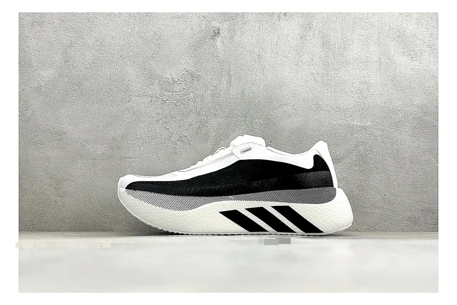 Adidas Hyper Boost White Black QC reference photo showing white knit runner upper, black Adidas striping, sculpted Boost-style sole, and modern low runner profile