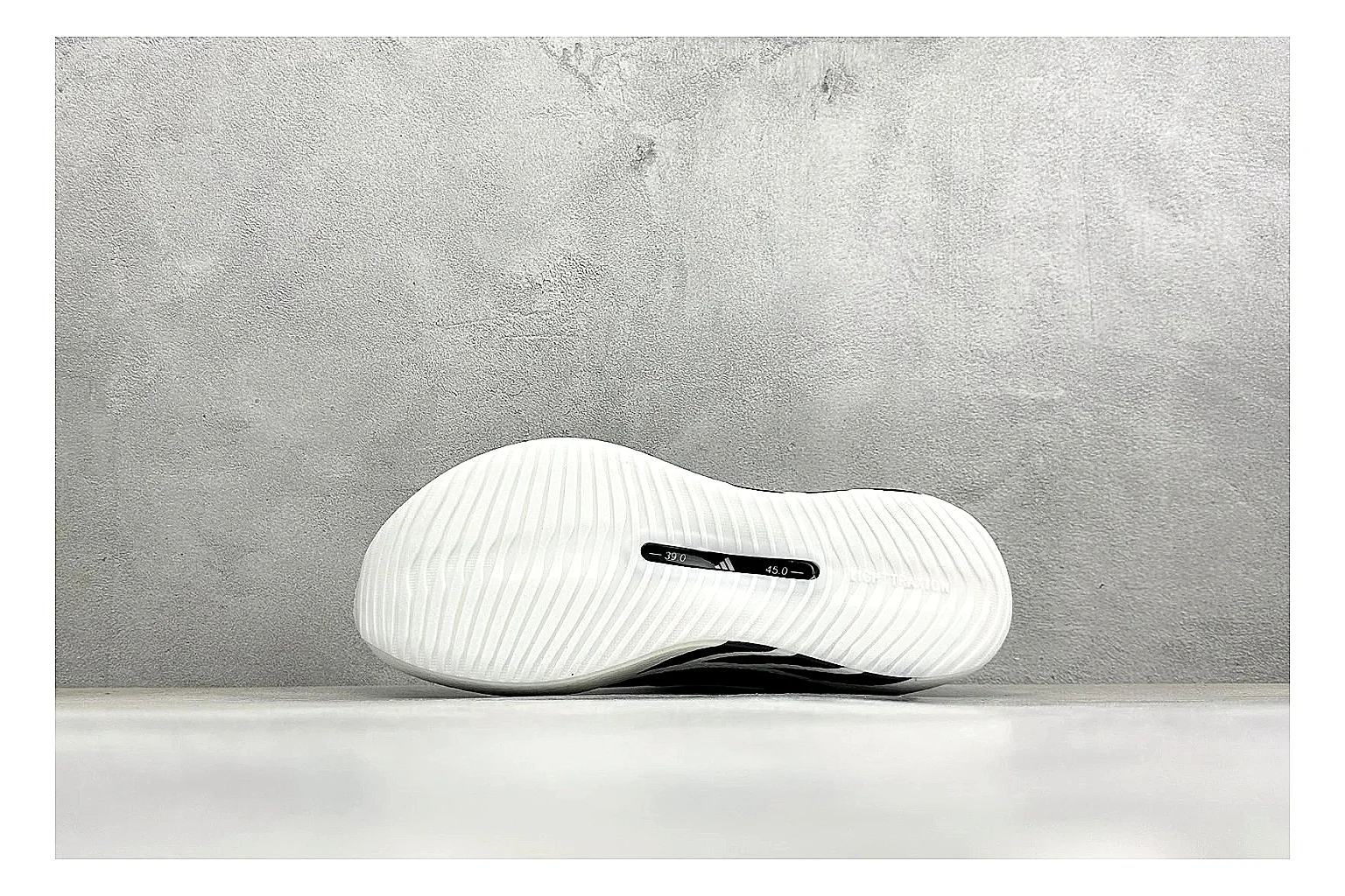 Adidas Hyper Boost White Black QC reference photo showing white knit runner upper, black Adidas striping, sculpted Boost-style sole, and modern low runner profile thumbnail 3