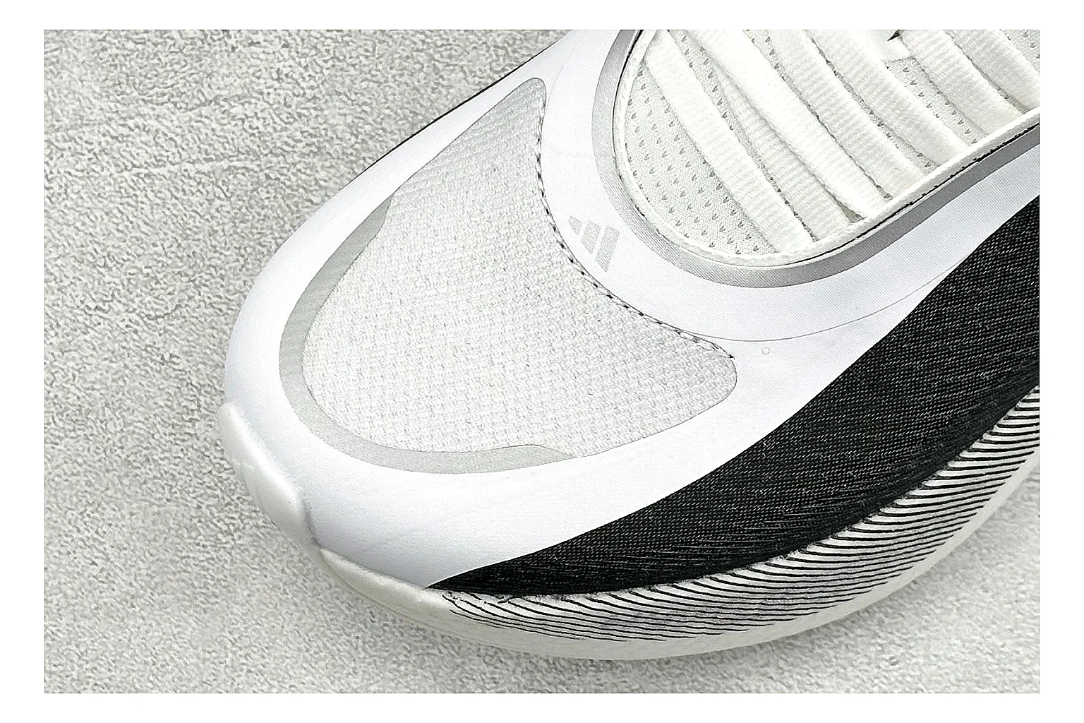 Adidas Hyper Boost White Black QC reference photo showing white knit runner upper, black Adidas striping, sculpted Boost-style sole, and modern low runner profile thumbnail 4