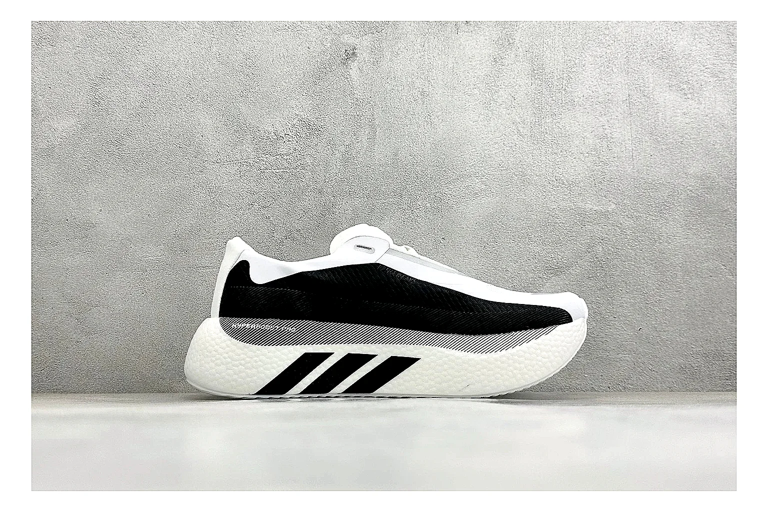 Adidas Hyper Boost White Black QC reference photo showing white knit runner upper, black Adidas striping, sculpted Boost-style sole, and modern low runner profile thumbnail 5