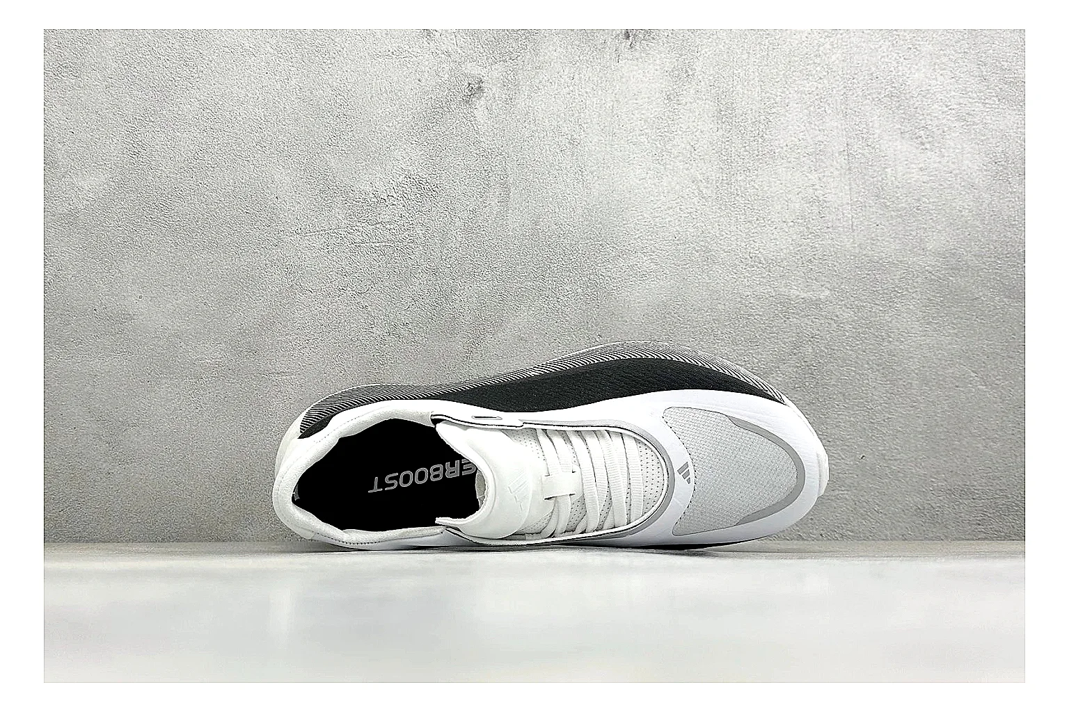 Adidas Hyper Boost White Black QC reference photo showing white knit runner upper, black Adidas striping, sculpted Boost-style sole, and modern low runner profile thumbnail 6
