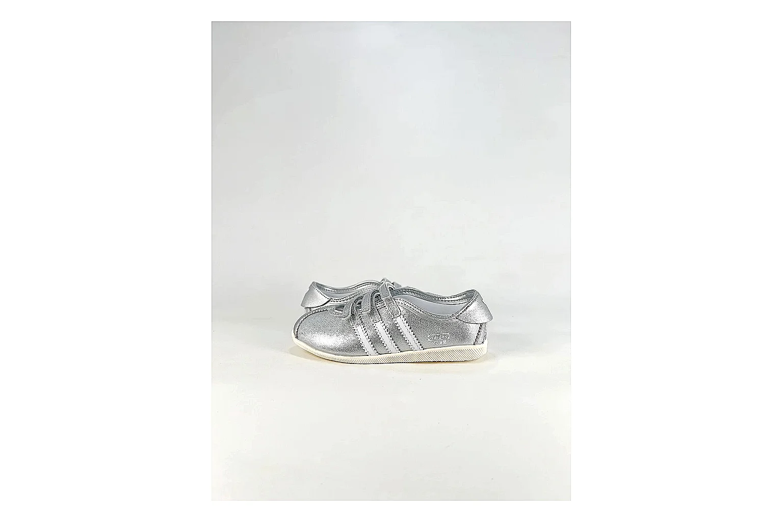 Adidas Originals Anfisa Silver Sneakers QC photo reference showing silver low-top sneakers with leather texture, side-profile shape, upper panel lines, and outsole detail