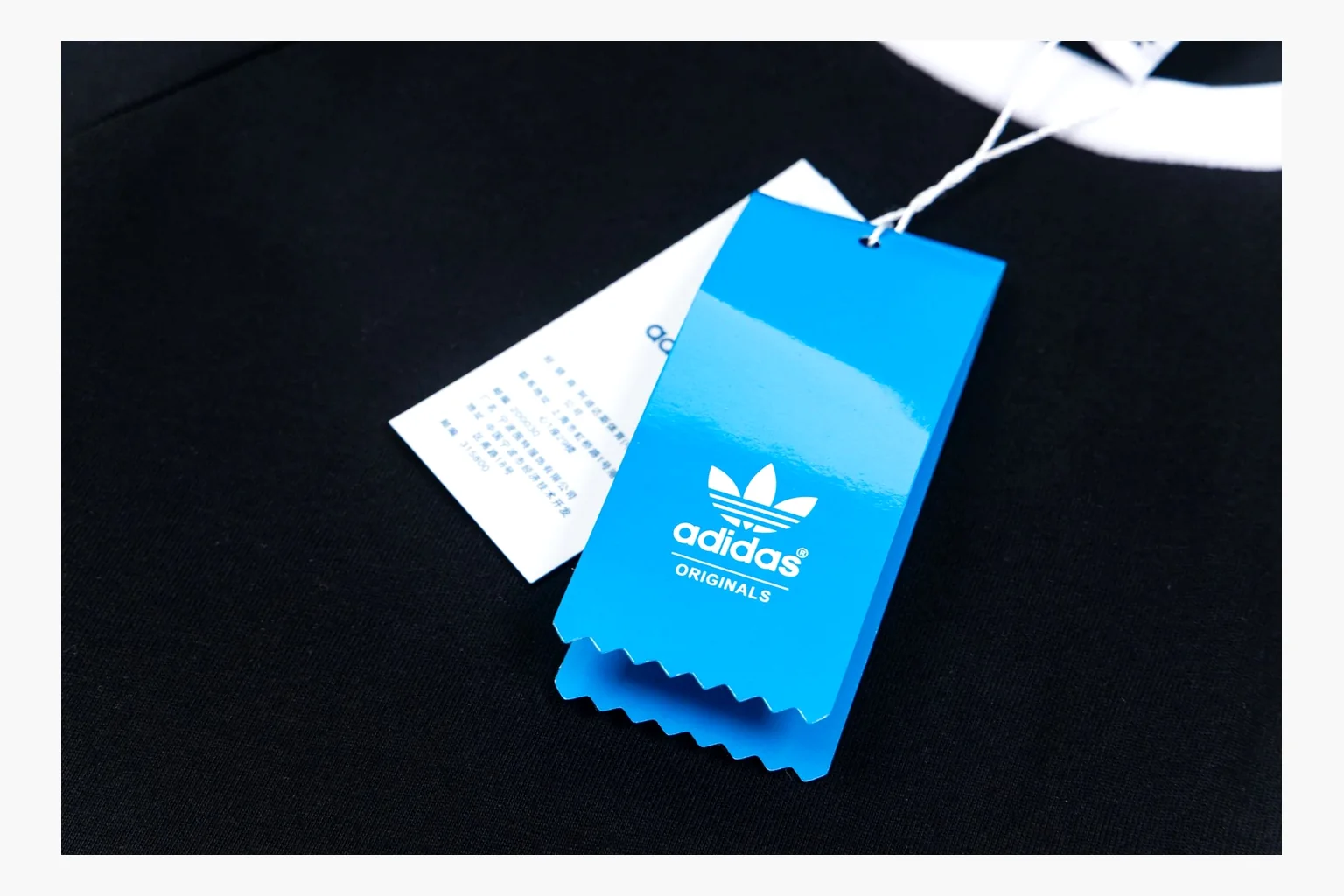 Adidas black ringer tee QC photo showing trim and trefoil thumbnail 2