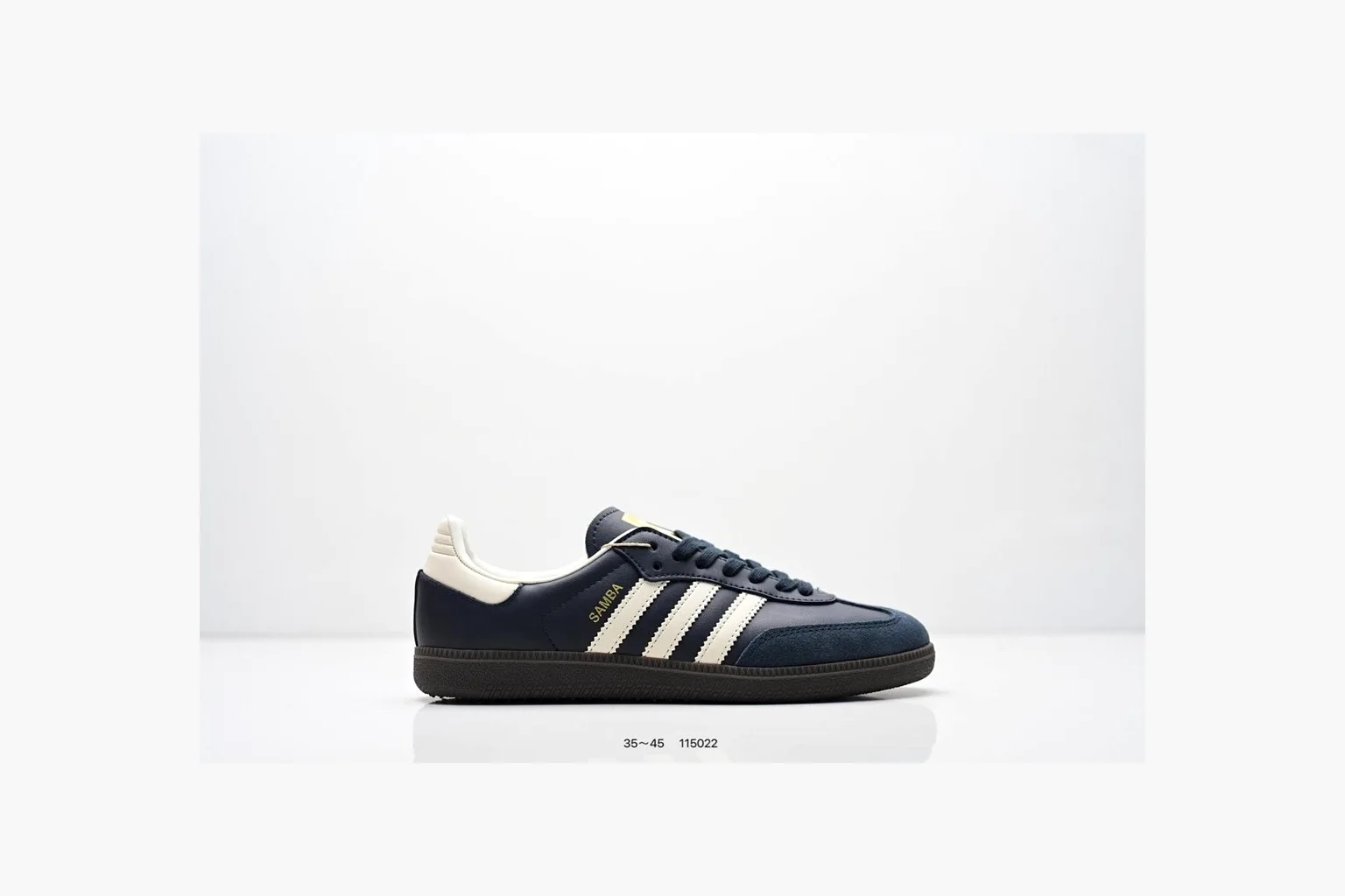 Adidas Samba OG Black White Gold QC reference photo showing black leather-suede low-top upper, white three stripes, gold tongue label, gum sole, and classic Samba side profile
