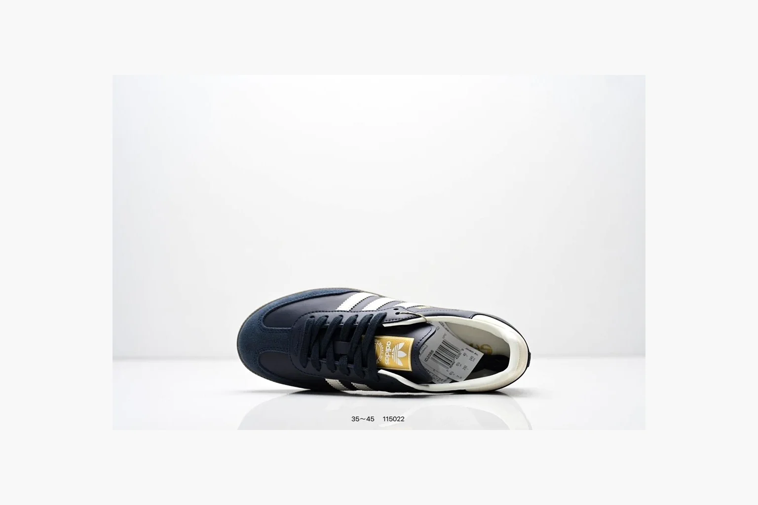 Adidas Samba OG Black White Gold QC reference photo showing black leather-suede low-top upper, white three stripes, gold tongue label, gum sole, and classic Samba side profile thumbnail 6