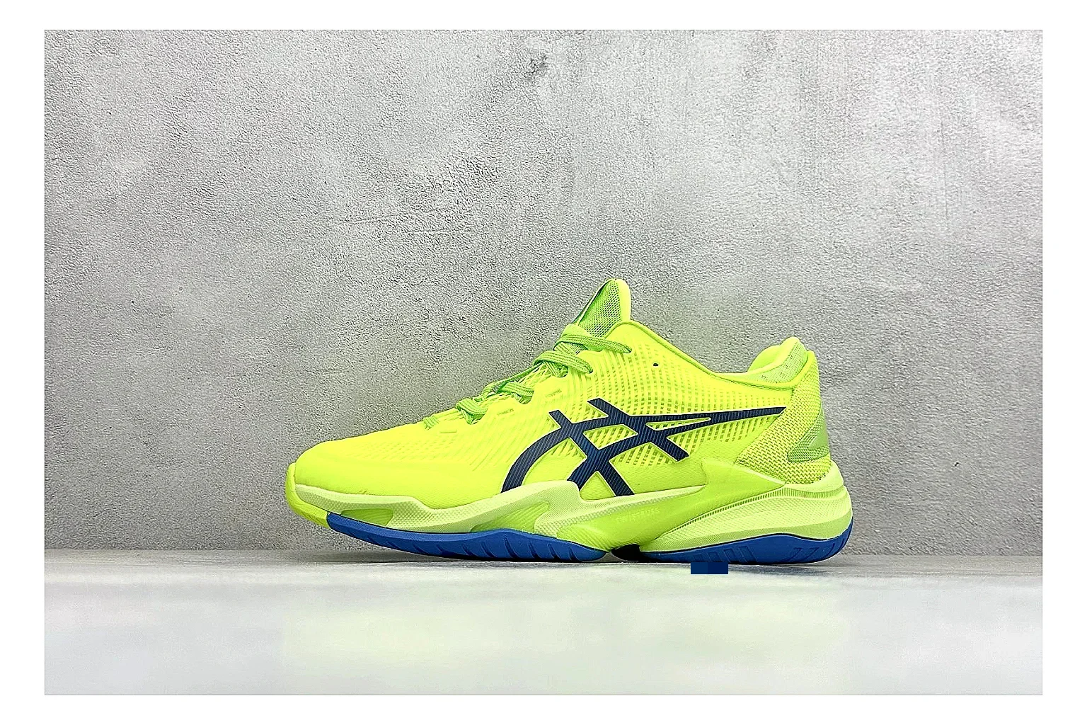 Asics Court FF Volt Blue QC reference photo showing bright volt and blue court upper, supportive sole wall, Asics side lines, and stable tennis profile