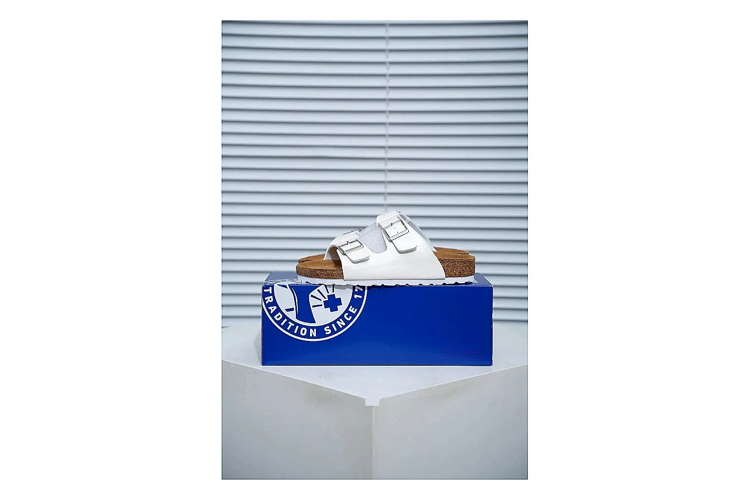 Birkenstock Arizona White Cork Slide QC photo showing adjustable buckles, contoured footbed and black outsole for clean summer casual styling