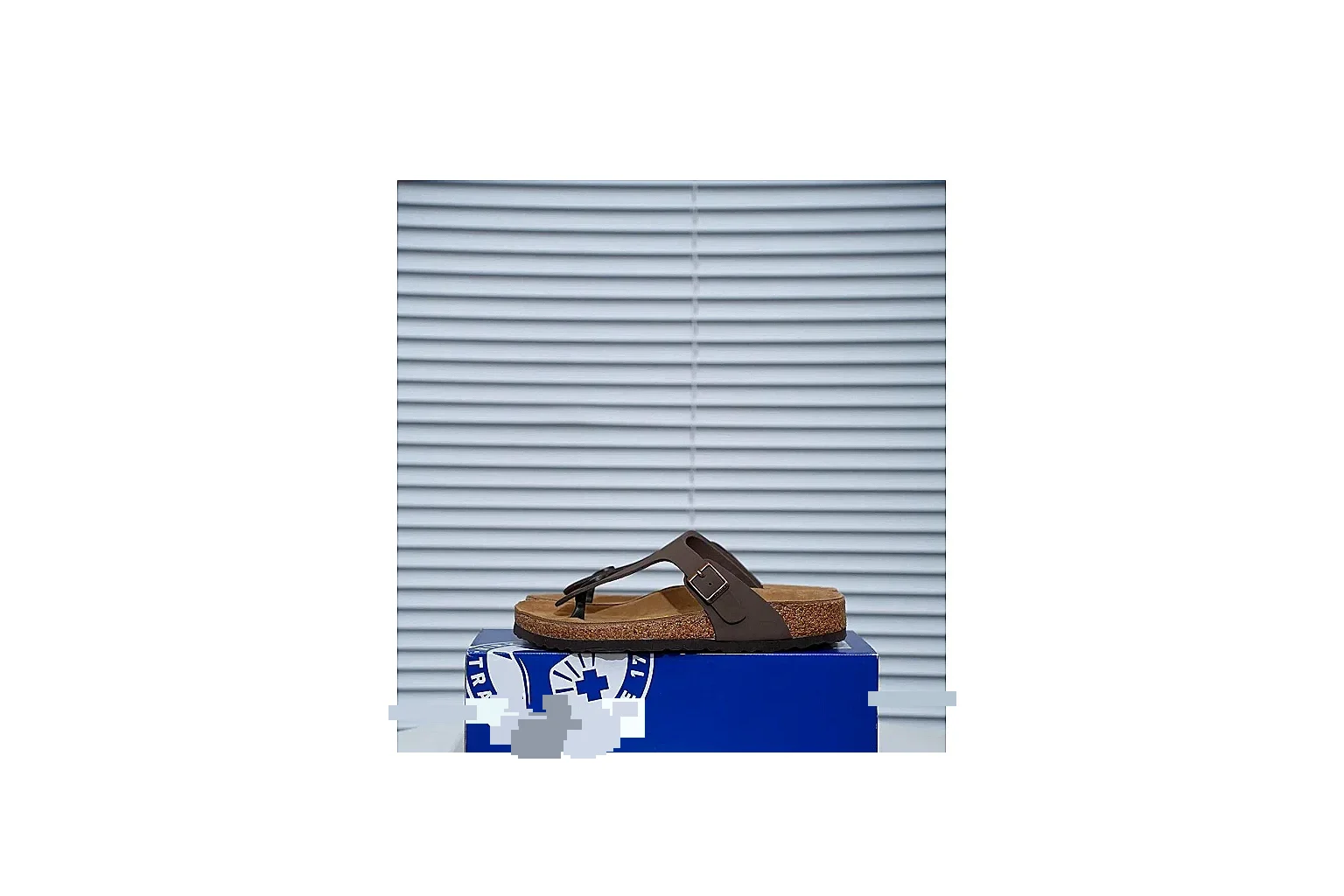 Birkenstock Brown Buckle Cork Slide QC photo showing wide strap, large metal buckle and contoured footbed for classic relaxed styling