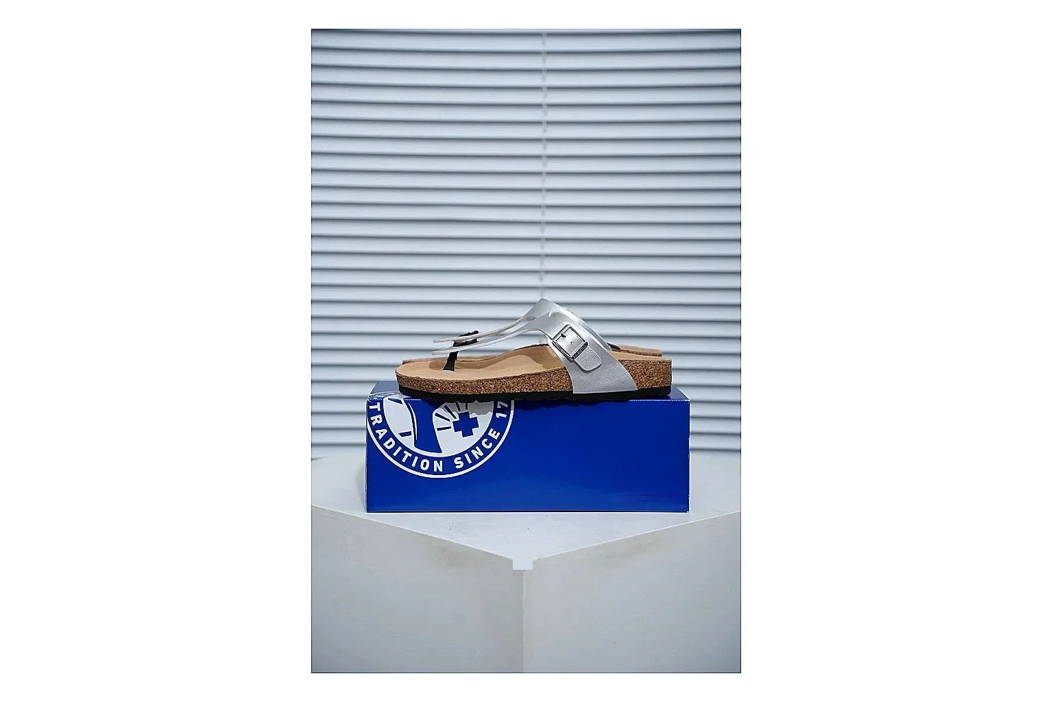 Birkenstock Cream Buckle Cork Slide QC photo showing wide strap, large metal buckle and contoured footbed for simple summer comfort