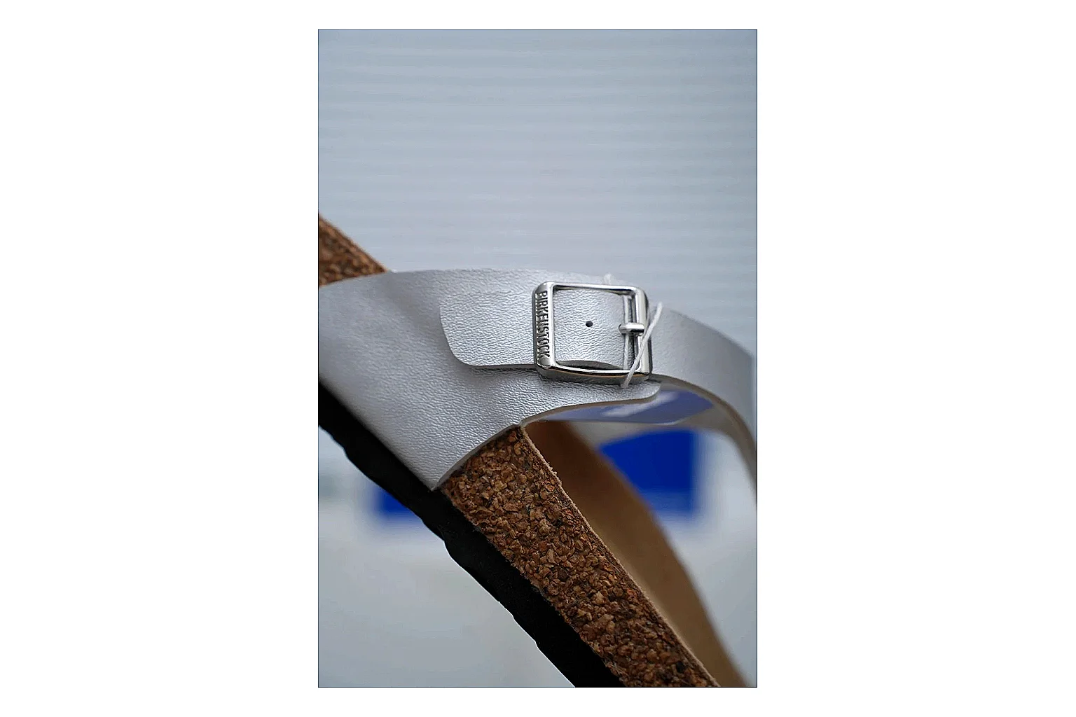 Birkenstock Cream Buckle Cork Slide QC photo showing wide strap, large metal buckle and contoured footbed for simple summer comfort