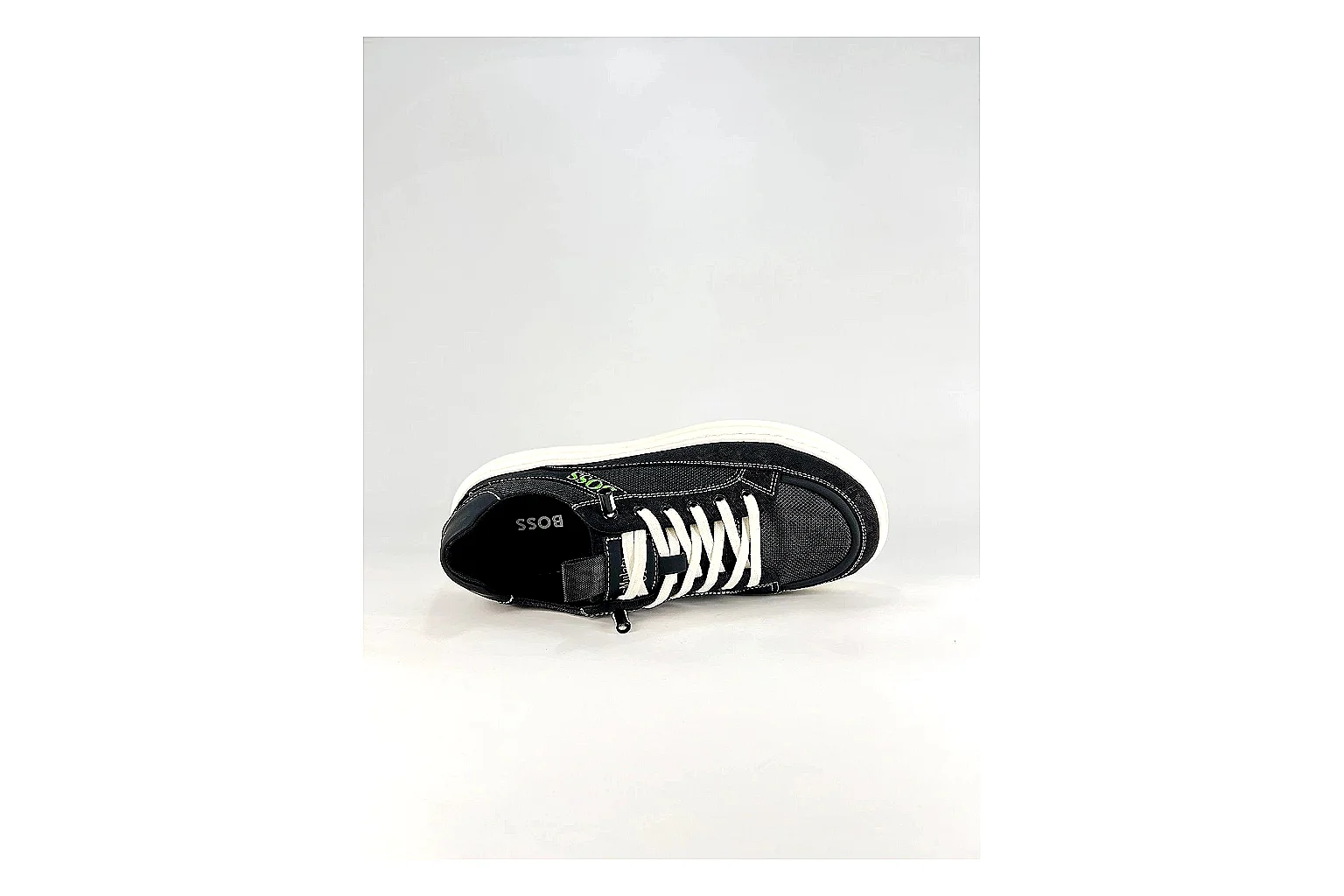 Boss Low Top Black White QC reference photo showing black white leather low-top upper, minimal casual profile, clean panels, and simple rubber sole thumbnail 4