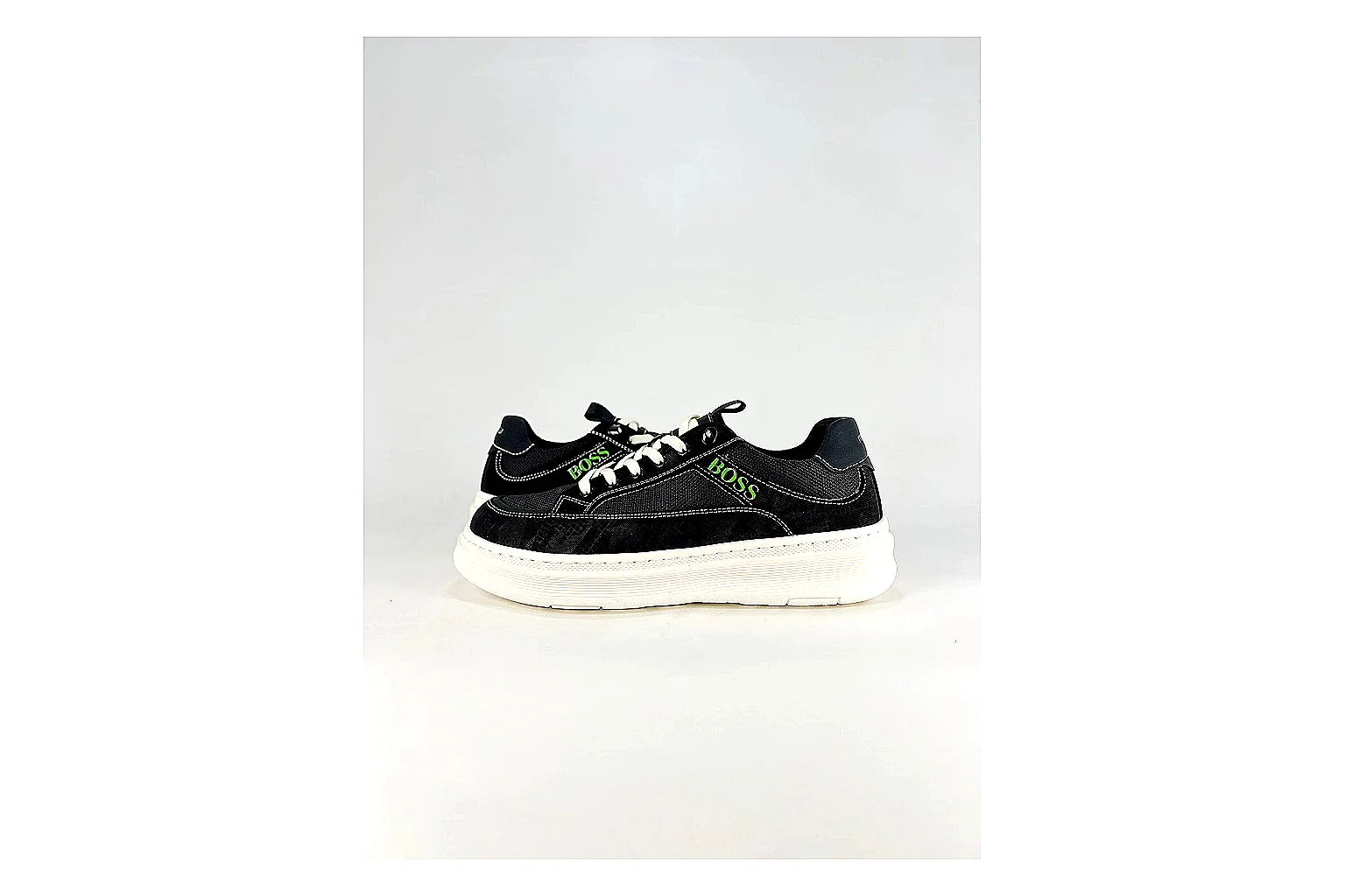 Boss Low Top Black White QC reference photo showing black white leather low-top upper, minimal casual profile, clean panels, and simple rubber sole thumbnail 5