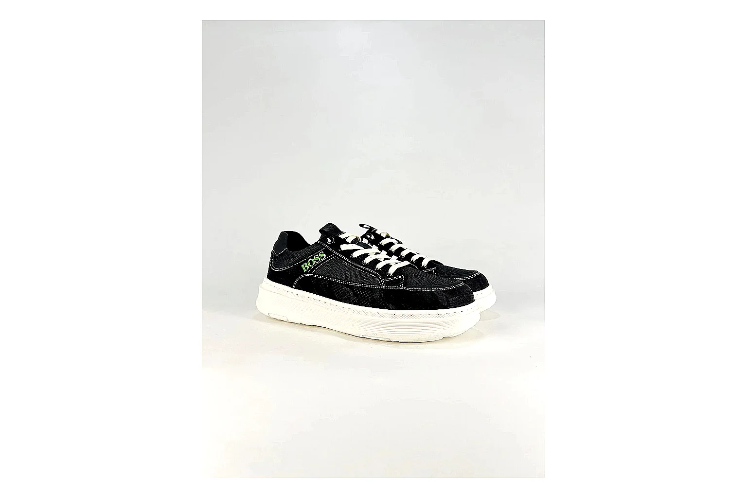 Boss Low Top Black White QC reference photo showing black white leather low-top upper, minimal casual profile, clean panels, and simple rubber sole thumbnail 6