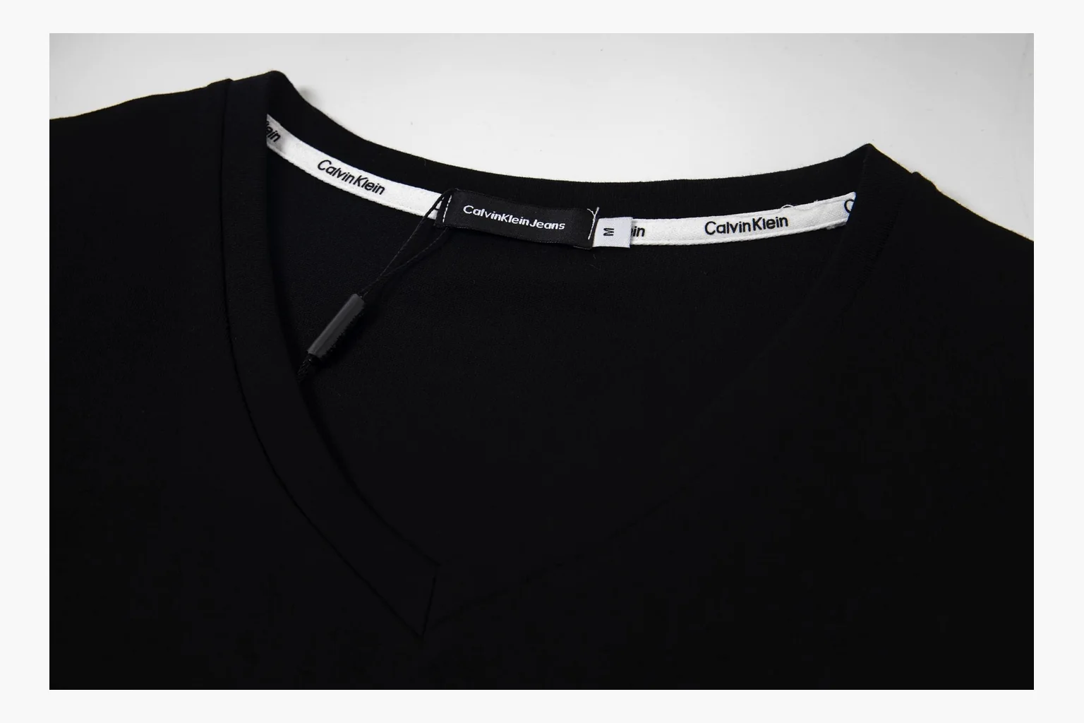 Calvin Klein black V-neck tee QC photo with chest print thumbnail 3