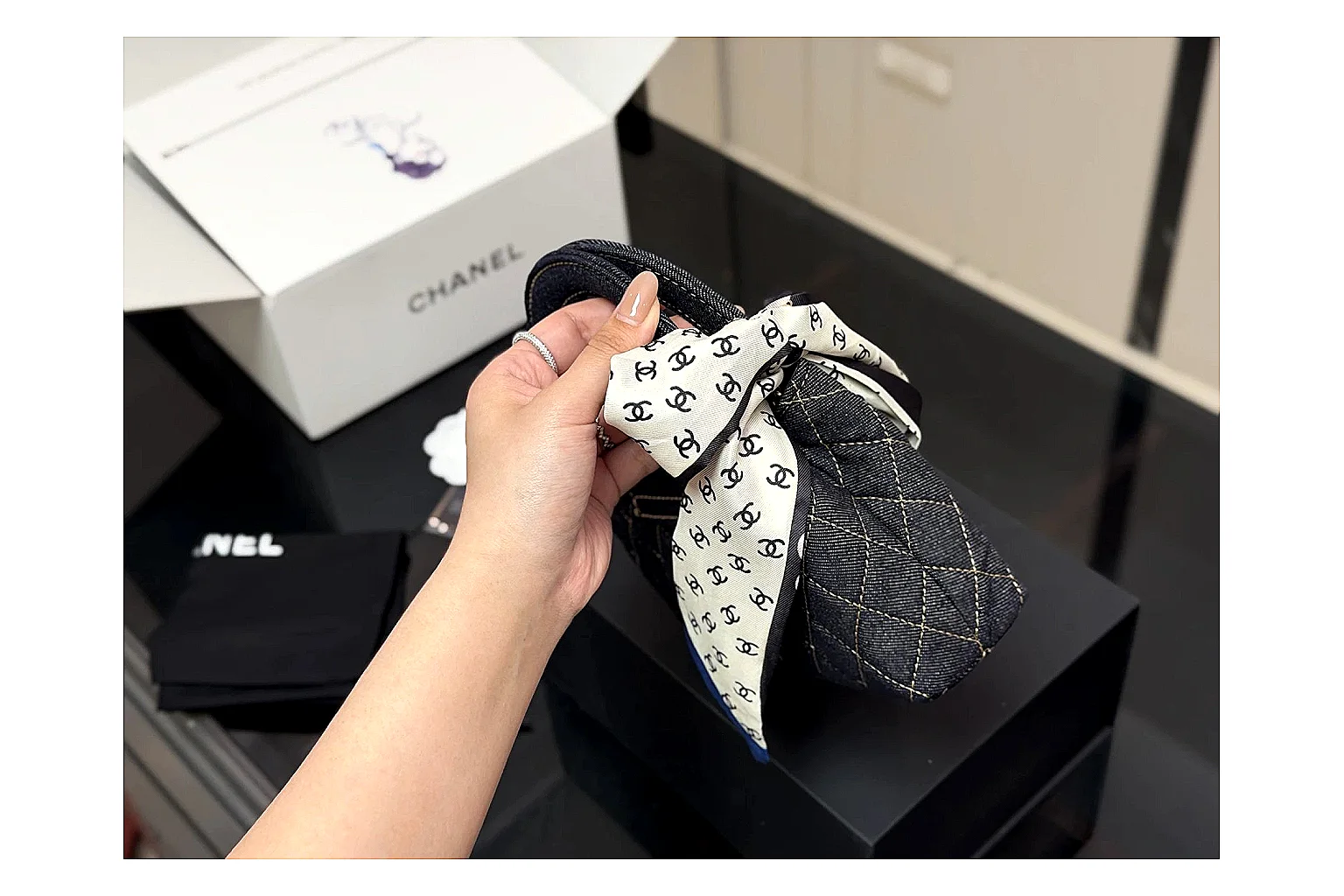Chanel Quilted Chain Bag Black QC reference photo showing black quilted leather body, chain strap, flap profile, and polished luxury hardware