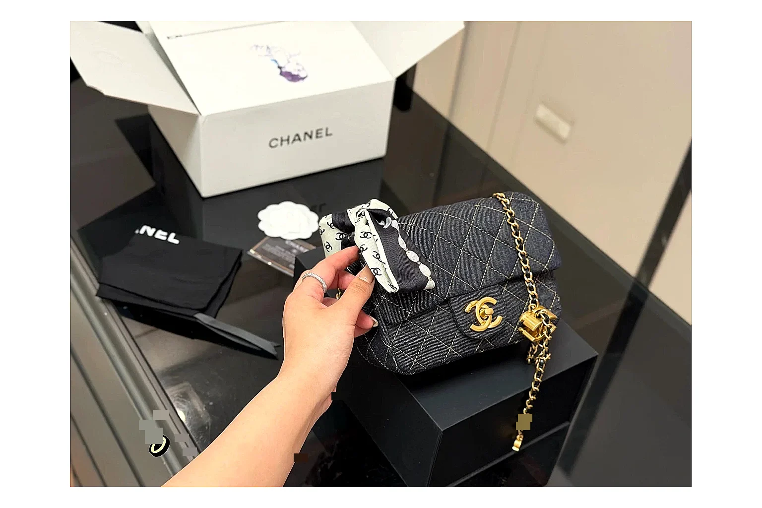Chanel Quilted Chain Bag Black QC reference photo showing black quilted leather body, chain shoulder strap, flap structure, and polished hardware