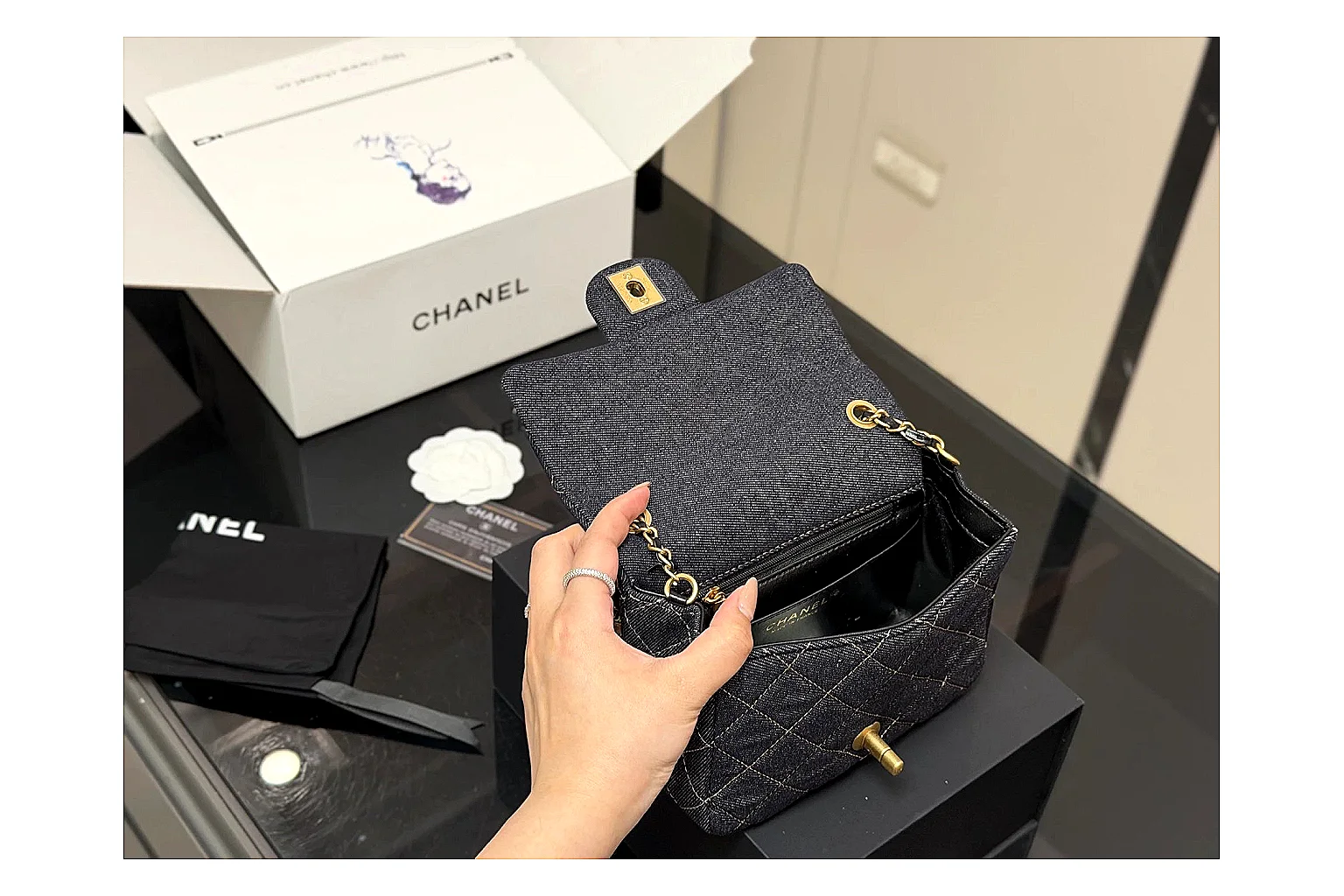 Chanel Quilted Chain Bag Black QC reference photo showing black quilted leather body, chain shoulder strap, flap structure, and polished hardware thumbnail 3