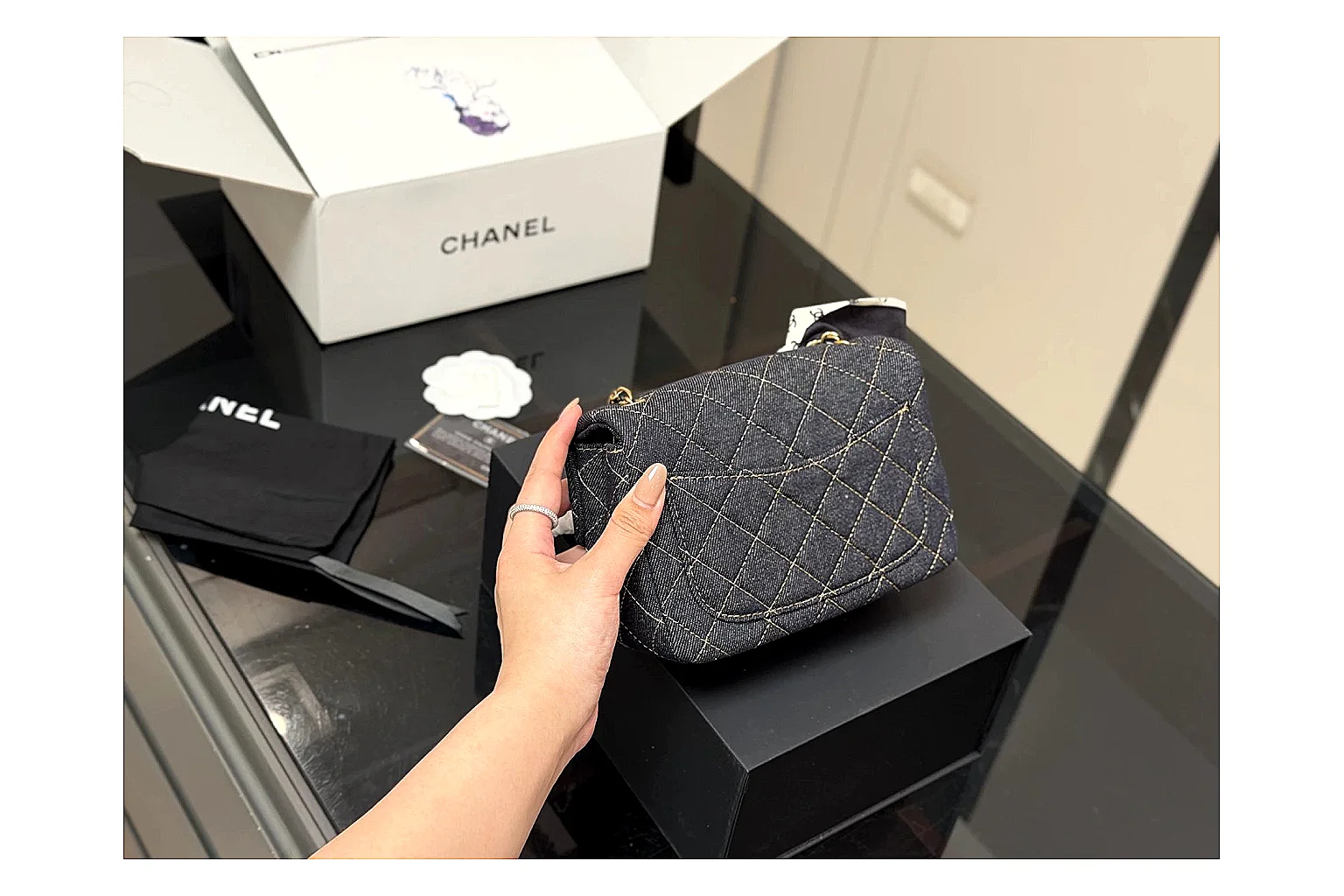 Chanel Quilted Chain Bag Black QC reference photo showing black quilted leather body, chain shoulder strap, flap structure, and polished hardware thumbnail 4
