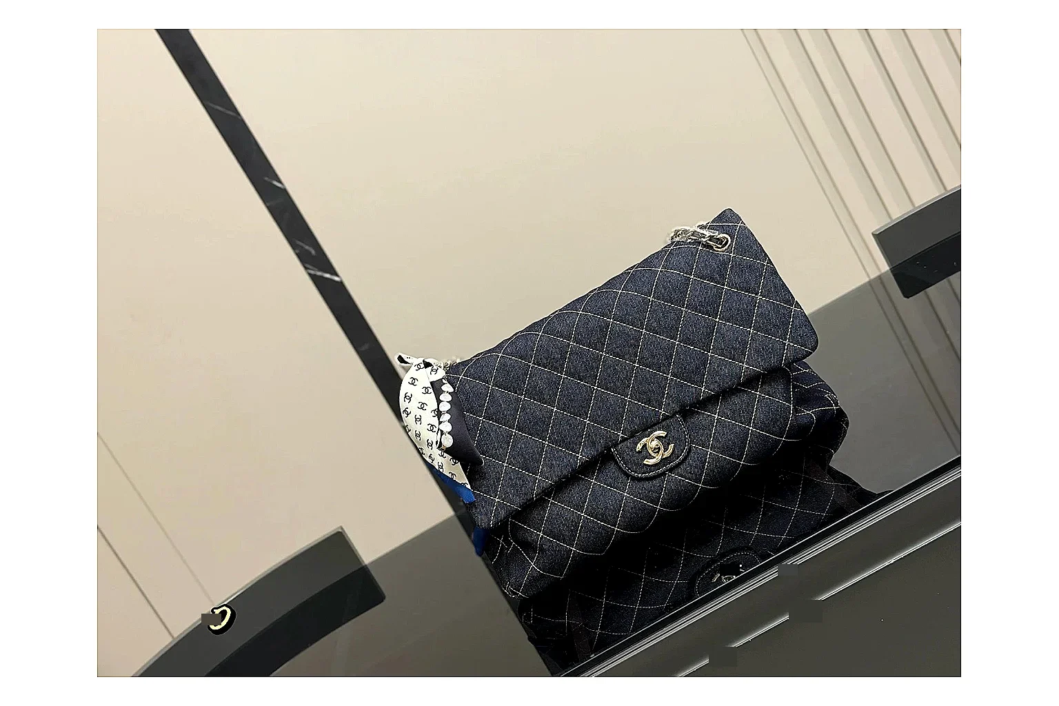 Chanel Quilted Flap Bag Black Denim QC reference photo showing black denim-look quilted flap body, shoulder-bag shape, chain strap, and polished hardware