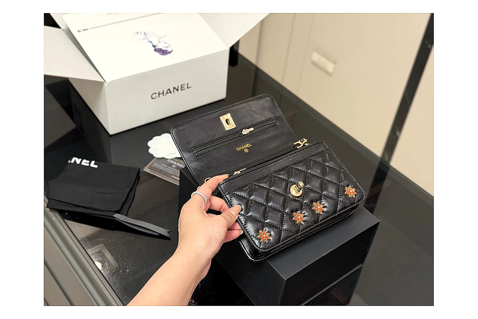 Chanel Quilted Wallet Bag Black Floral QC reference photo showing black quilted wallet-bag body, floral detail, compact flap shape, and polished chain hardware thumbnail 3