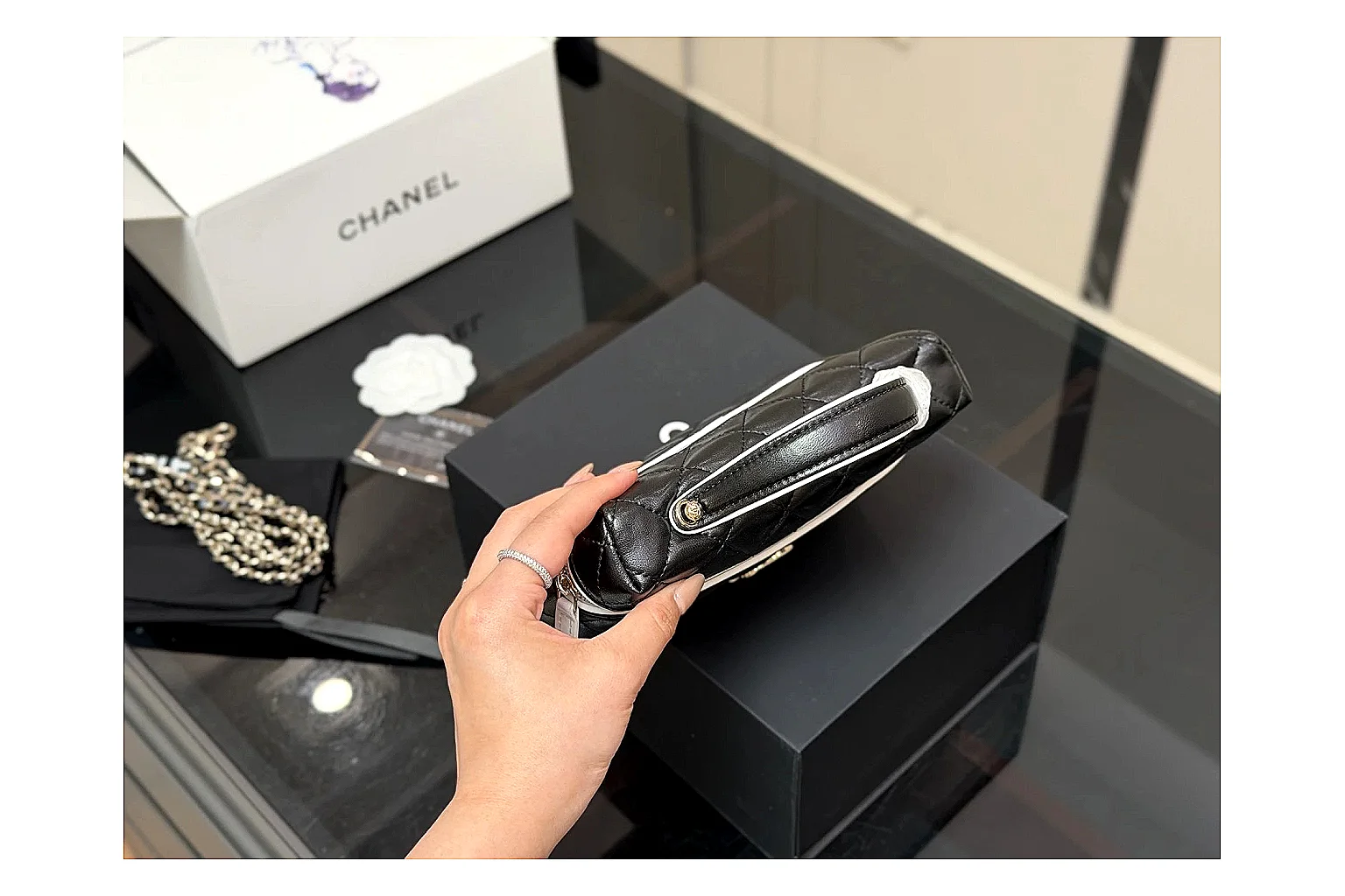 Chanel Wallet On Chain Black QC reference photo showing black quilted leather wallet body, chain strap, flap closure, and compact shoulder-bag profile thumbnail 6