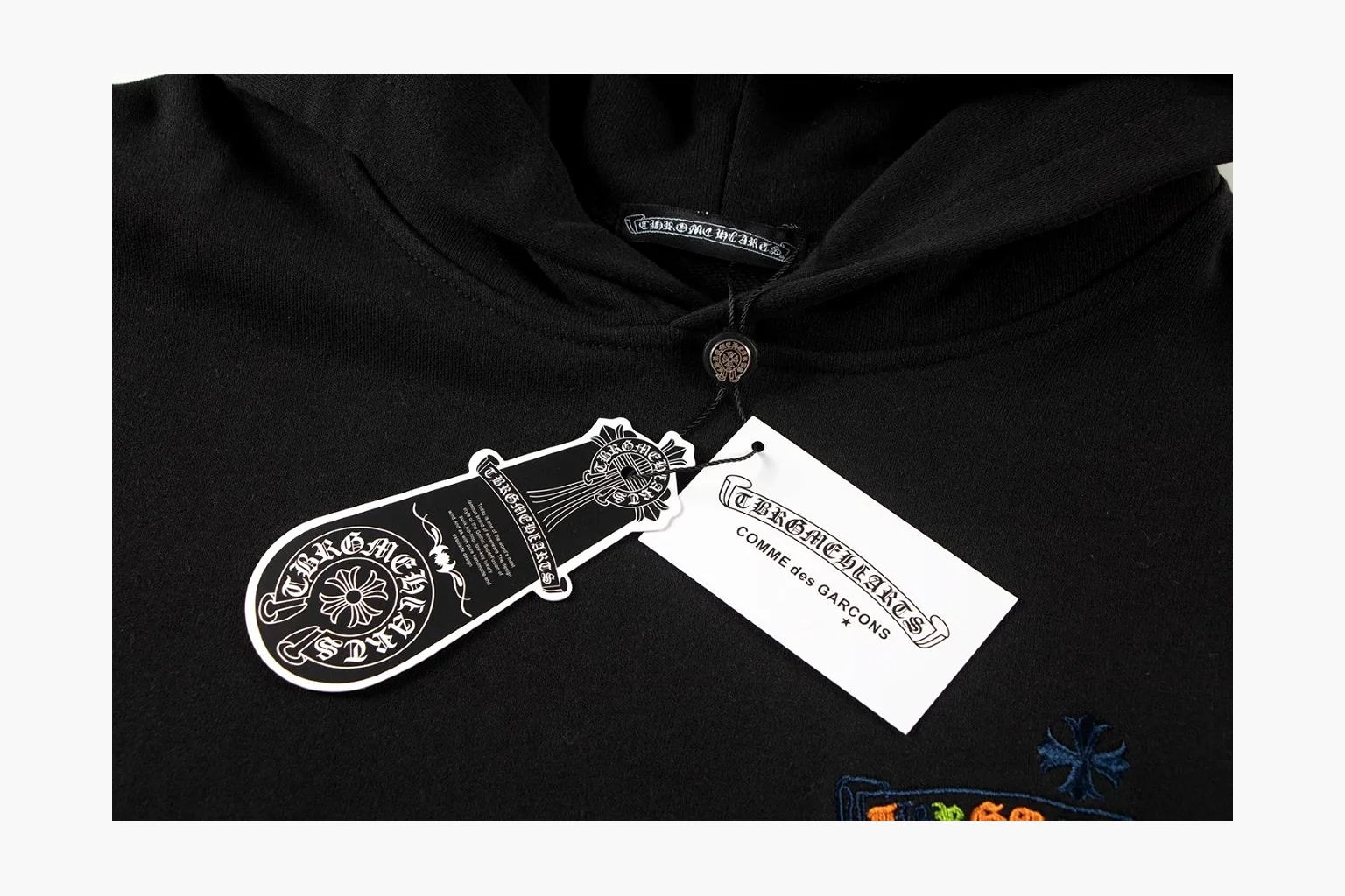 Chrome Hearts Rainbow Logo Hoodie Black QC reference photo showing black cotton fleece pullover body, colorful back logo, hood detail, sleeve print, kangaroo pocket, and ribbed trim