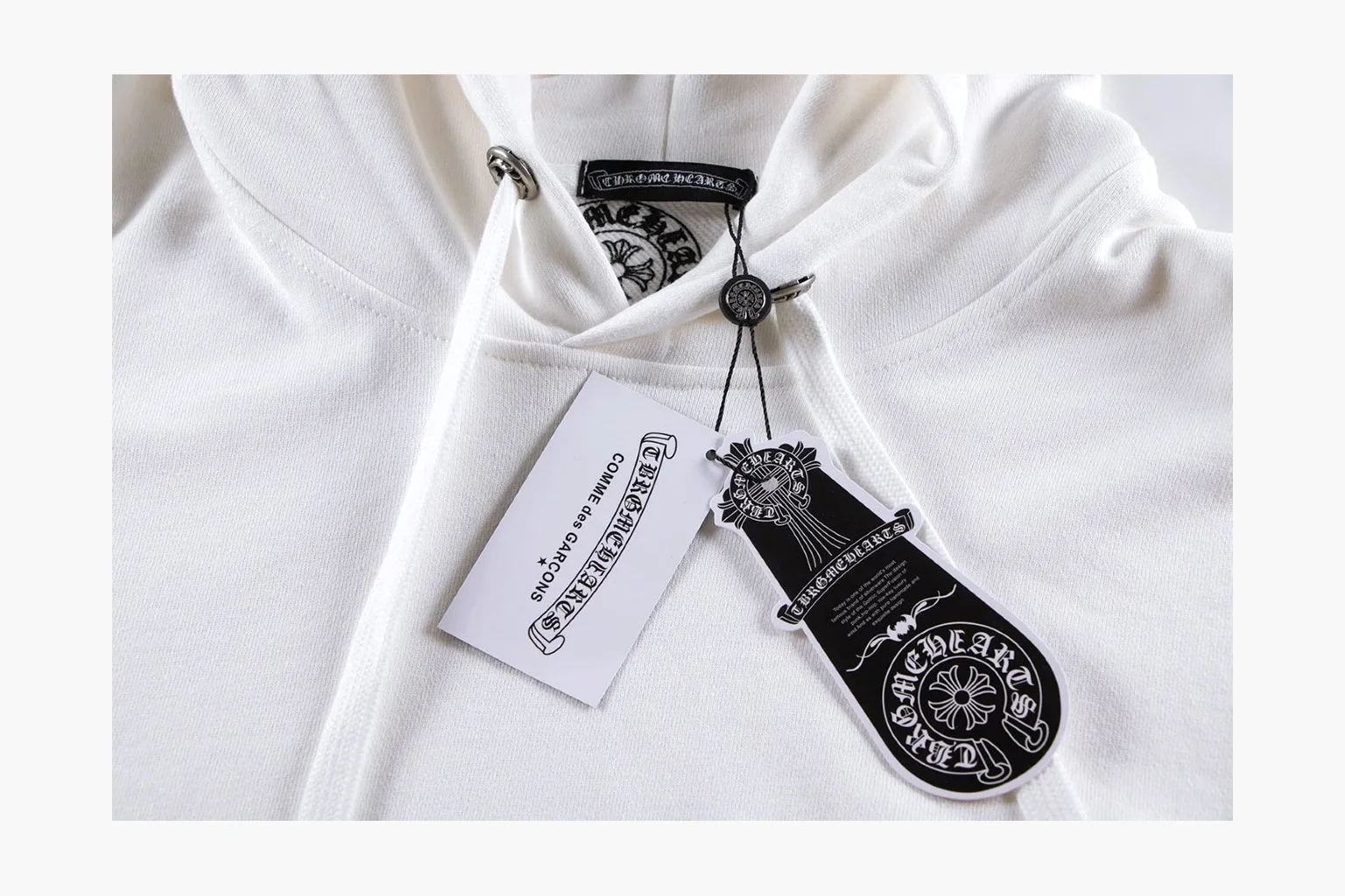 Chrome Hearts White Cross Zip Hoodie QC reference photo showing white cotton fleece zip hoodie, cross back artwork, drawcord hood, sleeve print, front zipper, and ribbed trim thumbnail 6