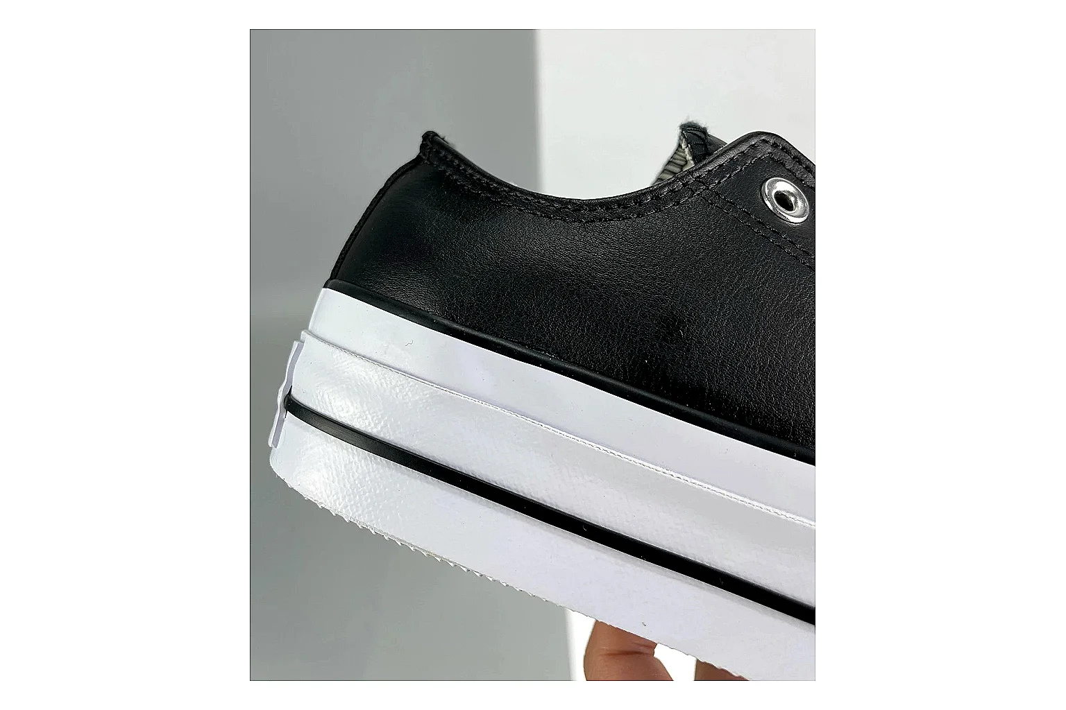 Converse All Star Lift Black Platform Low Top QC reference photo showing black leather low-top upper, silver eyelets, white rubber toe cap, and elevated striped platform sole thumbnail 4
