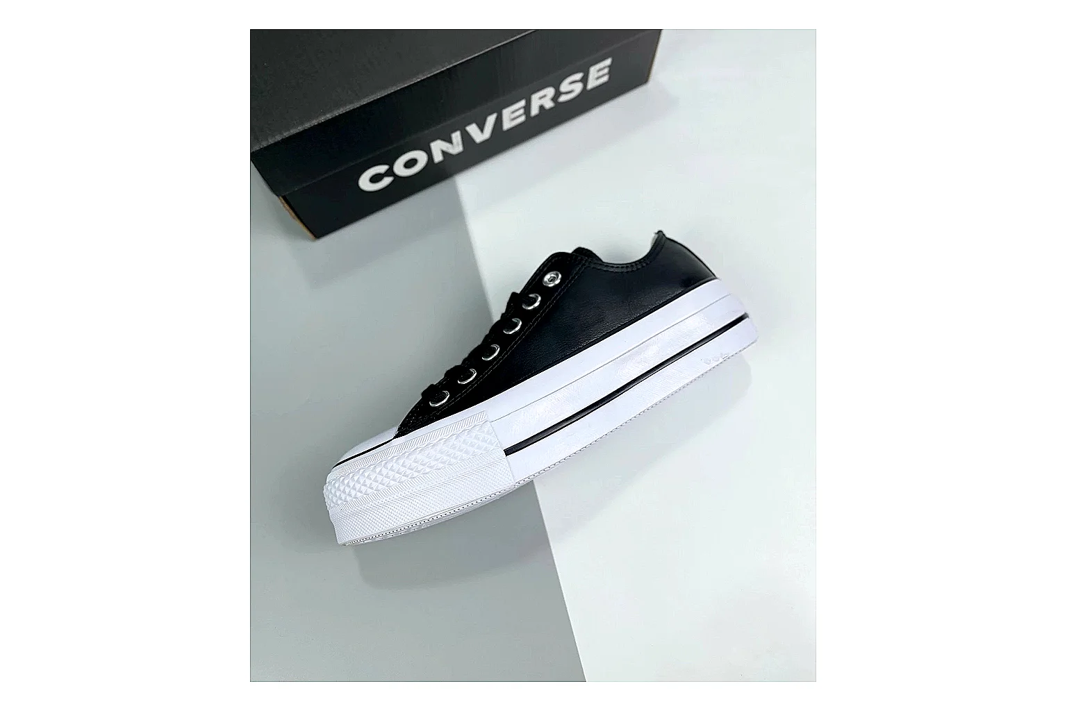 Converse All Star Lift Black Platform Low Top QC reference photo showing black leather low-top upper, silver eyelets, white rubber toe cap, and elevated striped platform sole thumbnail 5