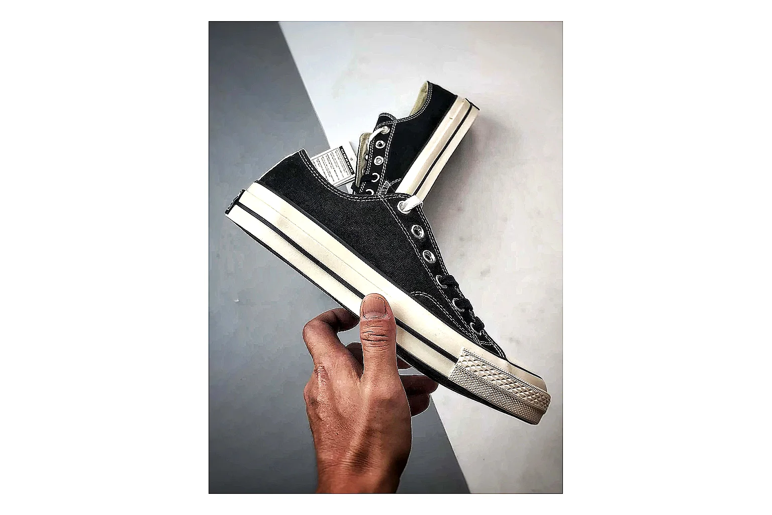 Converse Chuck Low Black White QC reference photo showing black canvas low-top upper, white rubber toe cap, metal eyelets, and classic Converse sole thumbnail 3
