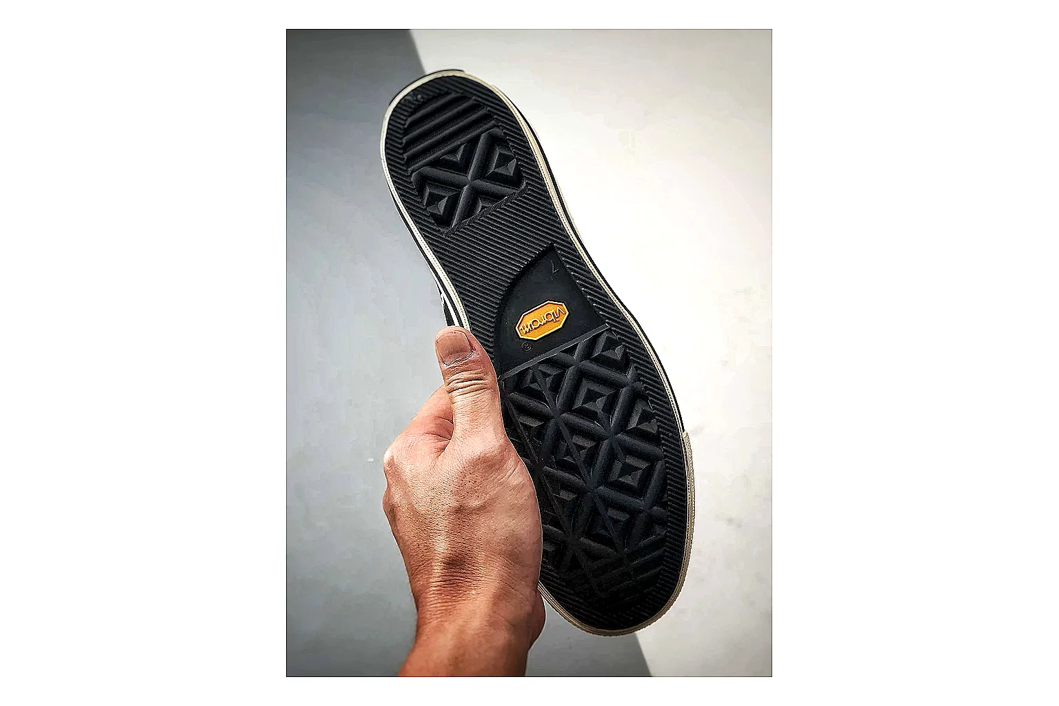 Converse Chuck Low Black White QC reference photo showing black canvas low-top upper, white rubber toe cap, metal eyelets, and classic Converse sole thumbnail 4