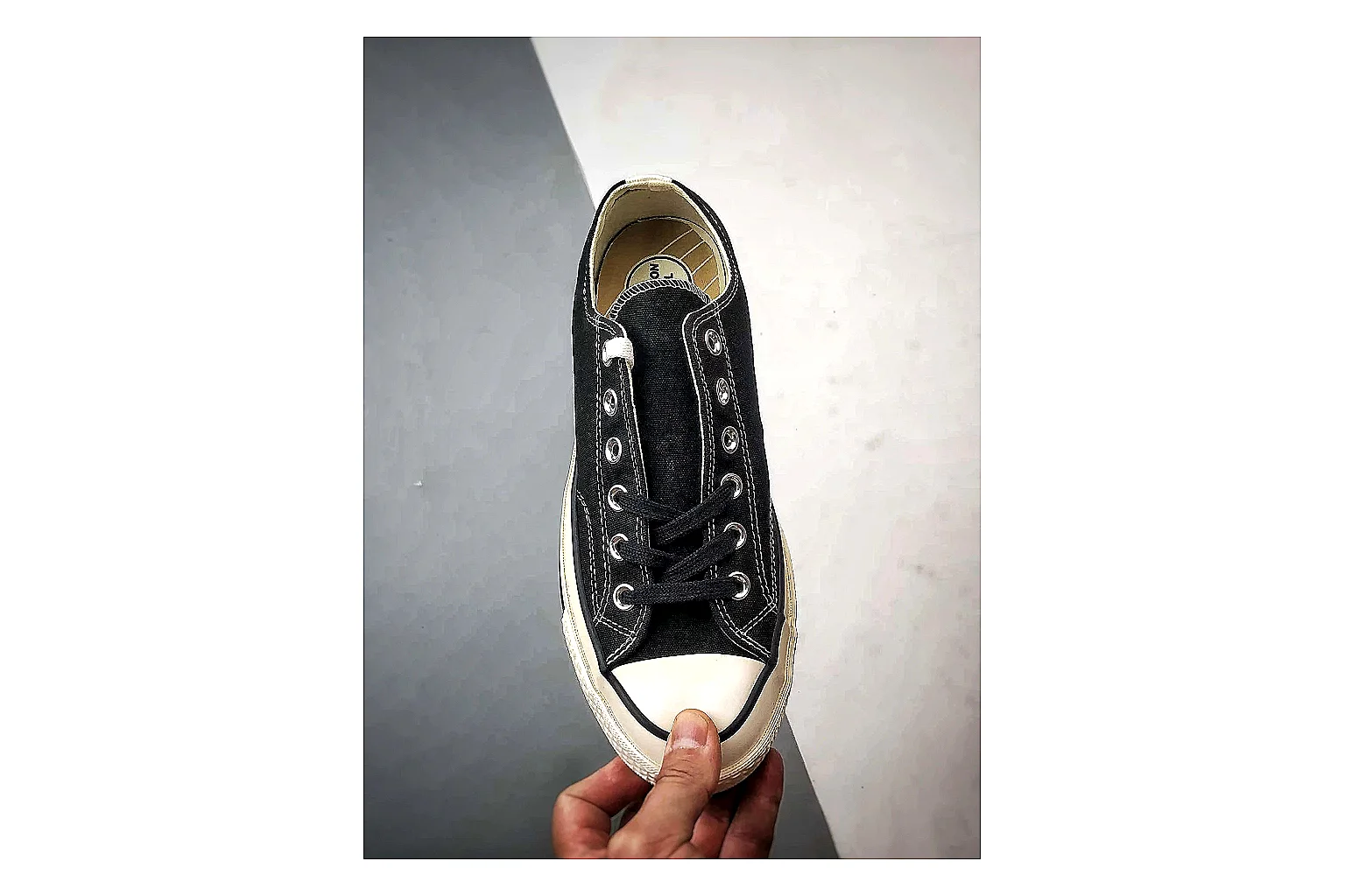 Converse Chuck Low Black White QC reference photo showing black canvas low-top upper, white rubber toe cap, metal eyelets, and classic Converse sole thumbnail 5