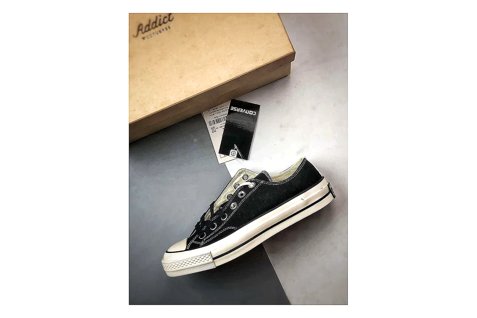 Converse Chuck Low Black White QC reference photo showing black canvas low-top upper, white rubber toe cap, metal eyelets, and classic Converse sole thumbnail 6
