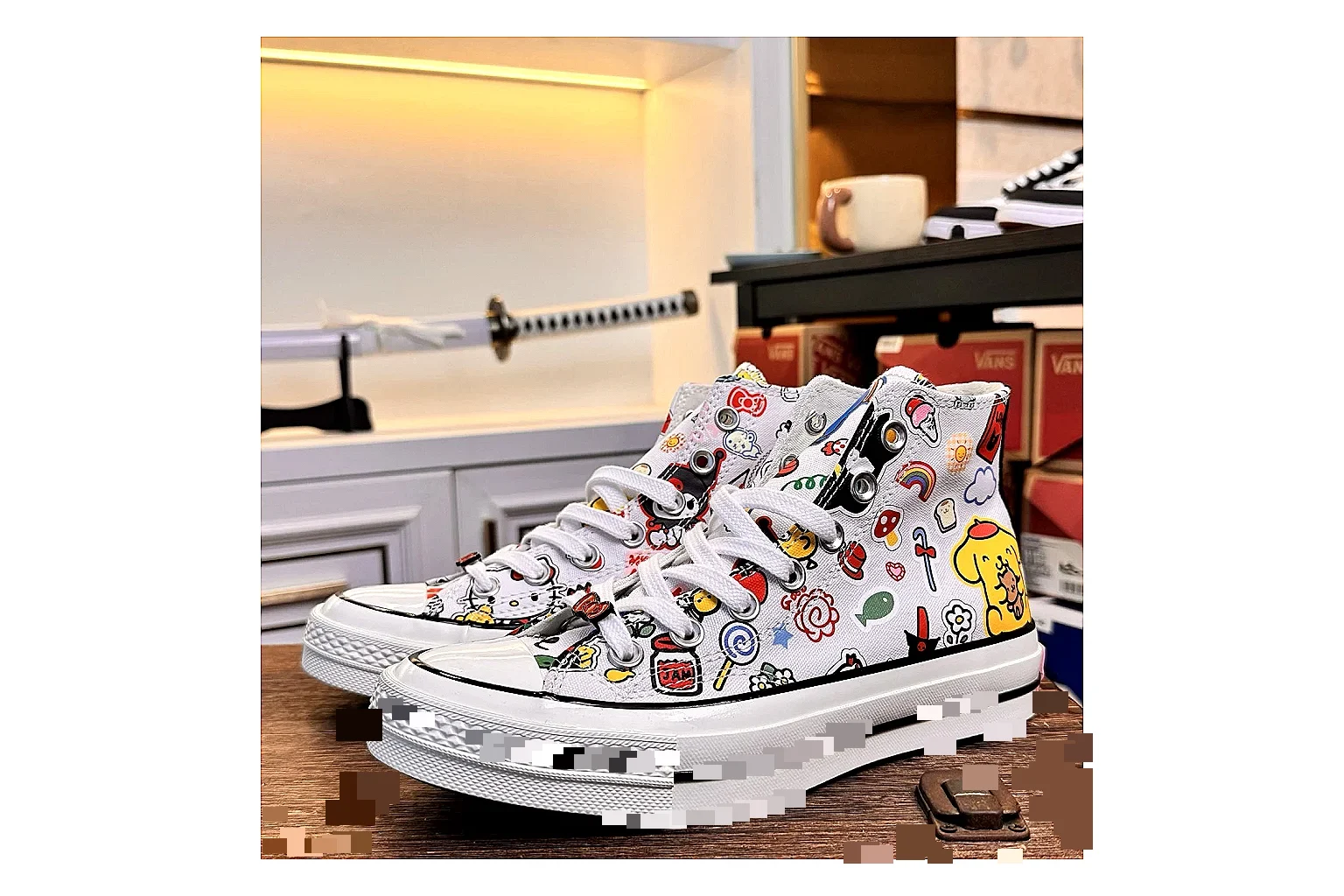 Converse Hello Kitty Chuck 70 High Top QC reference photo showing white canvas high-top upper, colorful character graphics, metal eyelets, rubber toe cap, and elevated vintage sole
