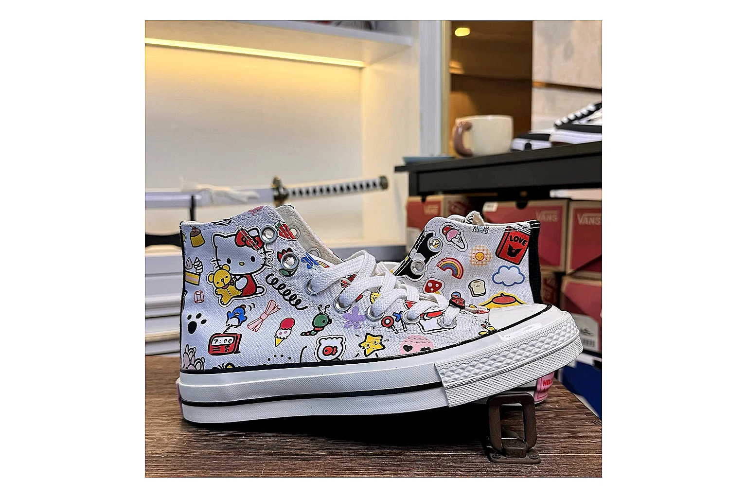 Converse Hello Kitty Chuck 70 High Top QC reference photo showing white canvas high-top upper, colorful character graphics, metal eyelets, rubber toe cap, and elevated vintage sole thumbnail 6