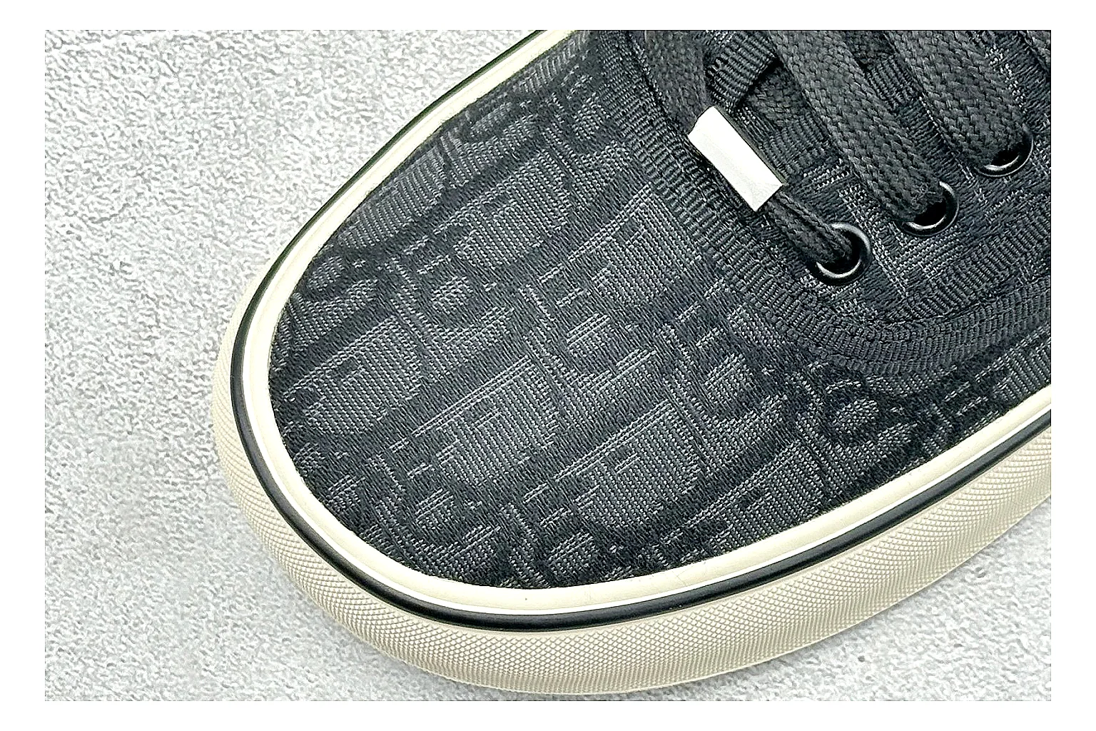 Dior Act Slide Black Low-Top QC reference photo showing black monogram-style upper, low slip-on shape, chunky dark sole, and luxury casual profile thumbnail 4