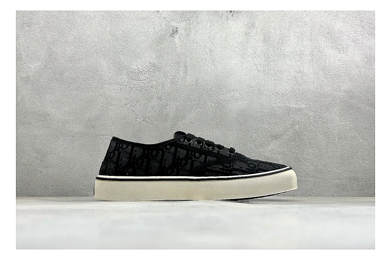 Dior Act Slide Black Low-Top QC reference photo showing black monogram-style upper, low slip-on shape, chunky dark sole, and luxury casual profile thumbnail 5