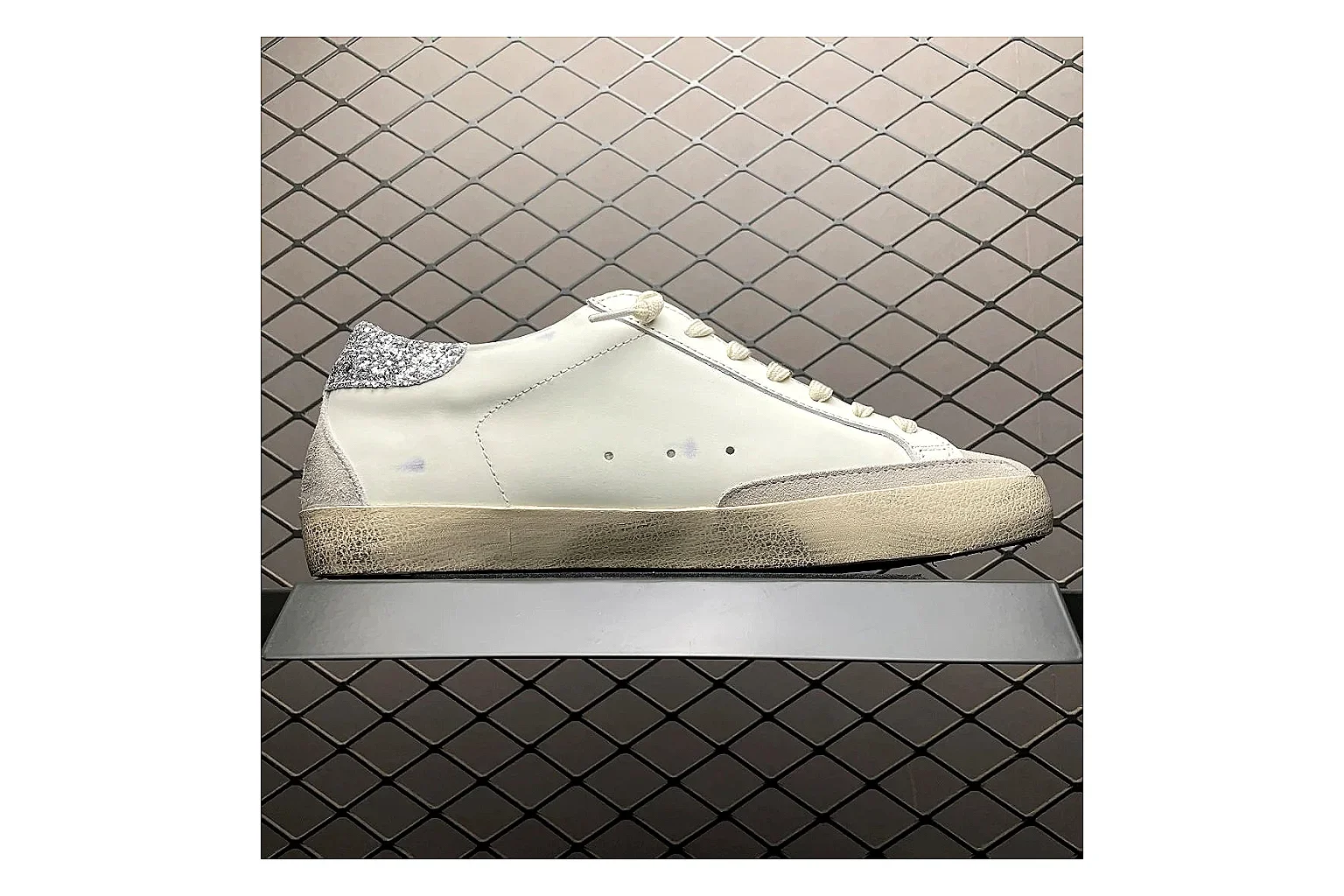 Golden Goose Super-Star White Silver QC photo showing white silver gold super-star distressed low-top with mixed upper and low top shape