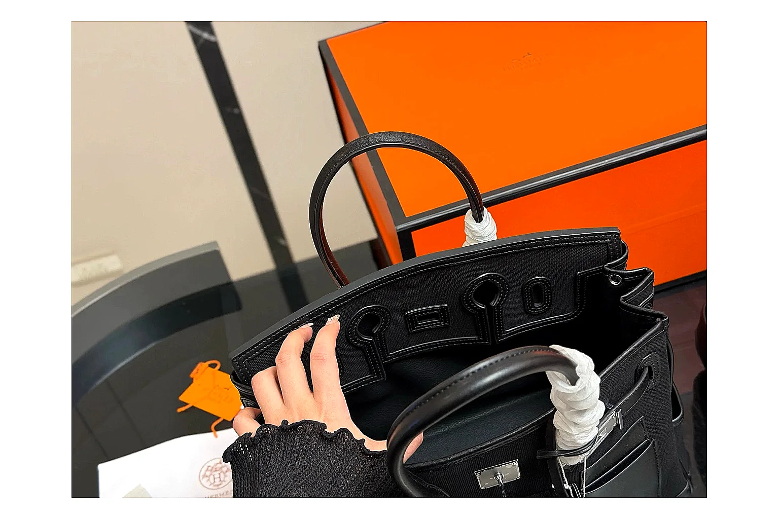 Hermes Birkin Style Black QC reference photo showing black leather structured body, top handles, flap-and-strap shape, and polished hardware thumbnail 3