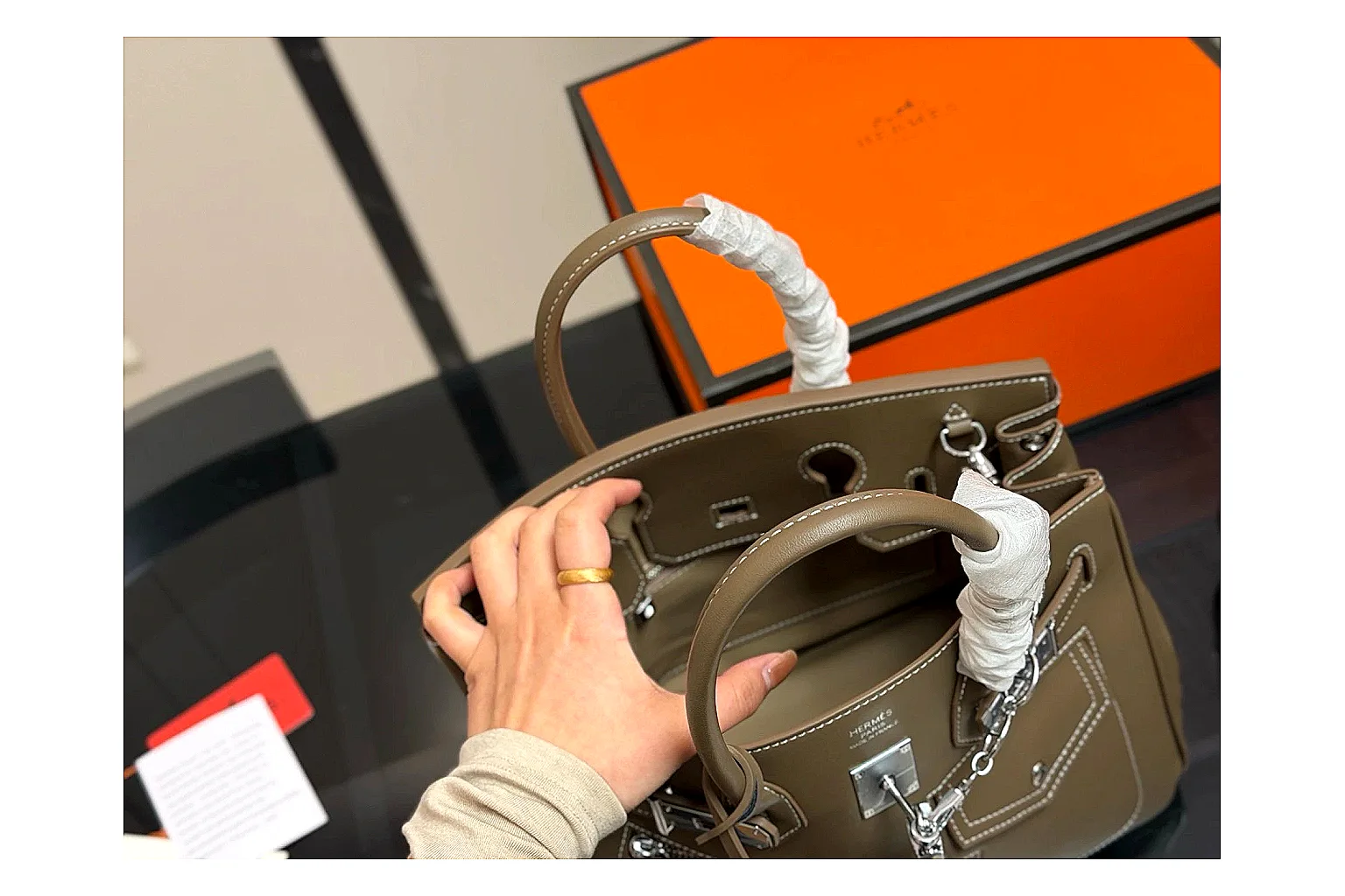 Hermes Birkin Style Olive QC reference photo showing olive leather structured body, top handles, flap-and-strap shape, and polished hardware thumbnail 3