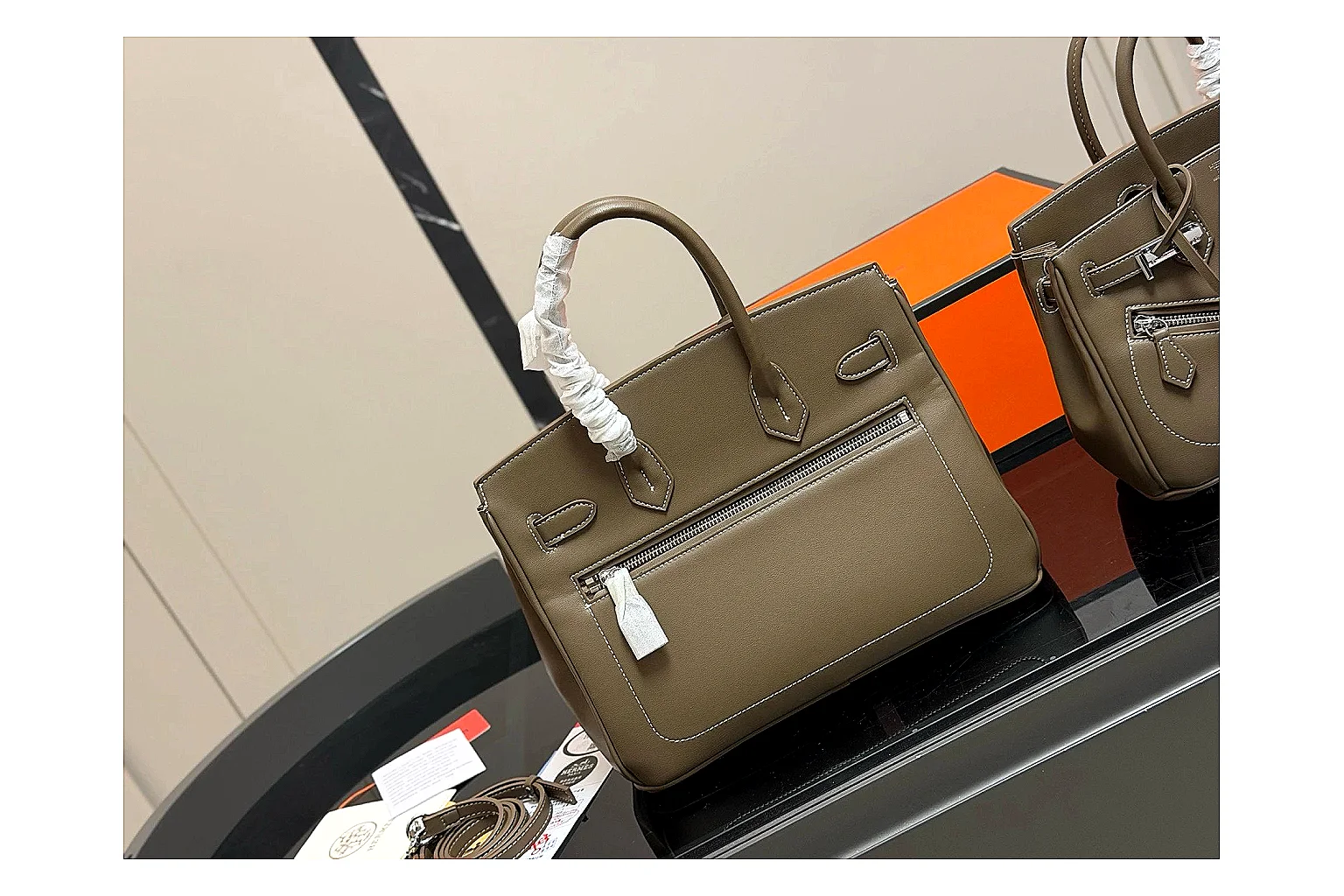 Hermes Birkin Style Olive QC reference photo showing olive leather structured body, top handles, flap-and-strap shape, and polished hardware thumbnail 4