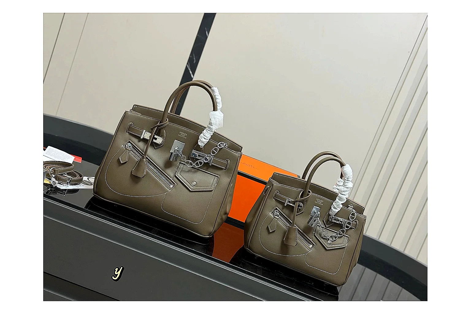 Hermes Birkin Style Olive QC reference photo showing olive leather structured body, top handles, flap-and-strap shape, and polished hardware thumbnail 5