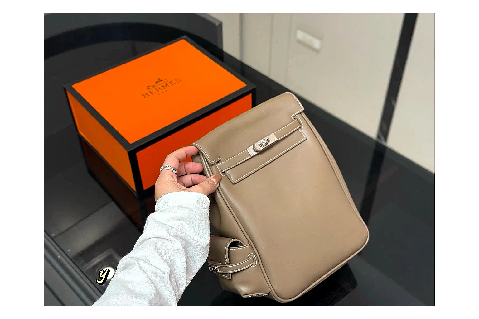 Hermes Kelly Backpack Beige QC reference photo showing beige leather backpack body, Kelly-style flap, top handle, shoulder straps, and polished hardware thumbnail 5