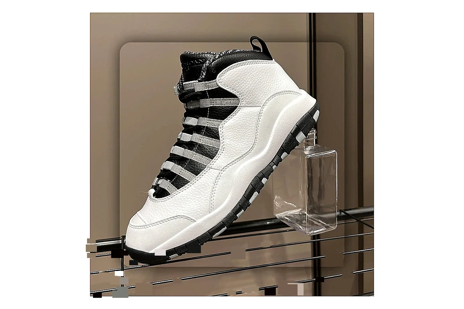 Jordan Air Jordan 10 Steel White Black QC reference photo showing white and black high-top court upper, striped lace panels, Jumpman heel branding, and retro sole