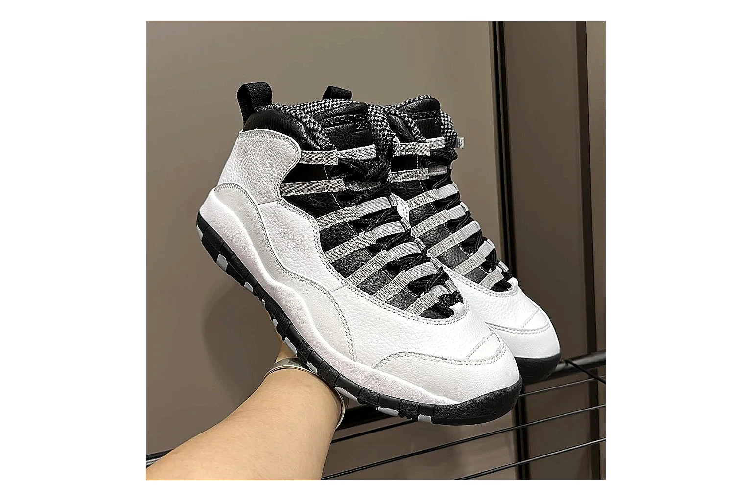 Jordan Air Jordan 10 Steel White Black QC reference photo showing white and black high-top court upper, striped lace panels, Jumpman heel branding, and retro sole thumbnail 2